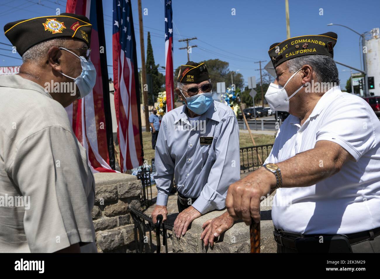 Veterans wearing face masks due to the COVID 19 pandemic attend a Memorial Day ceremony in Los Angeles, California on May 25, 2020. The event took place at the Los Cinco Puntos/Five Points Memorial that honors Mexican American soldiers who died in World War II, the Korean War, and the Vietnam War. (Photo by Ronen Tivony/Sipa USA) *** Please Use Credit from Credit Field *** Stock Photo