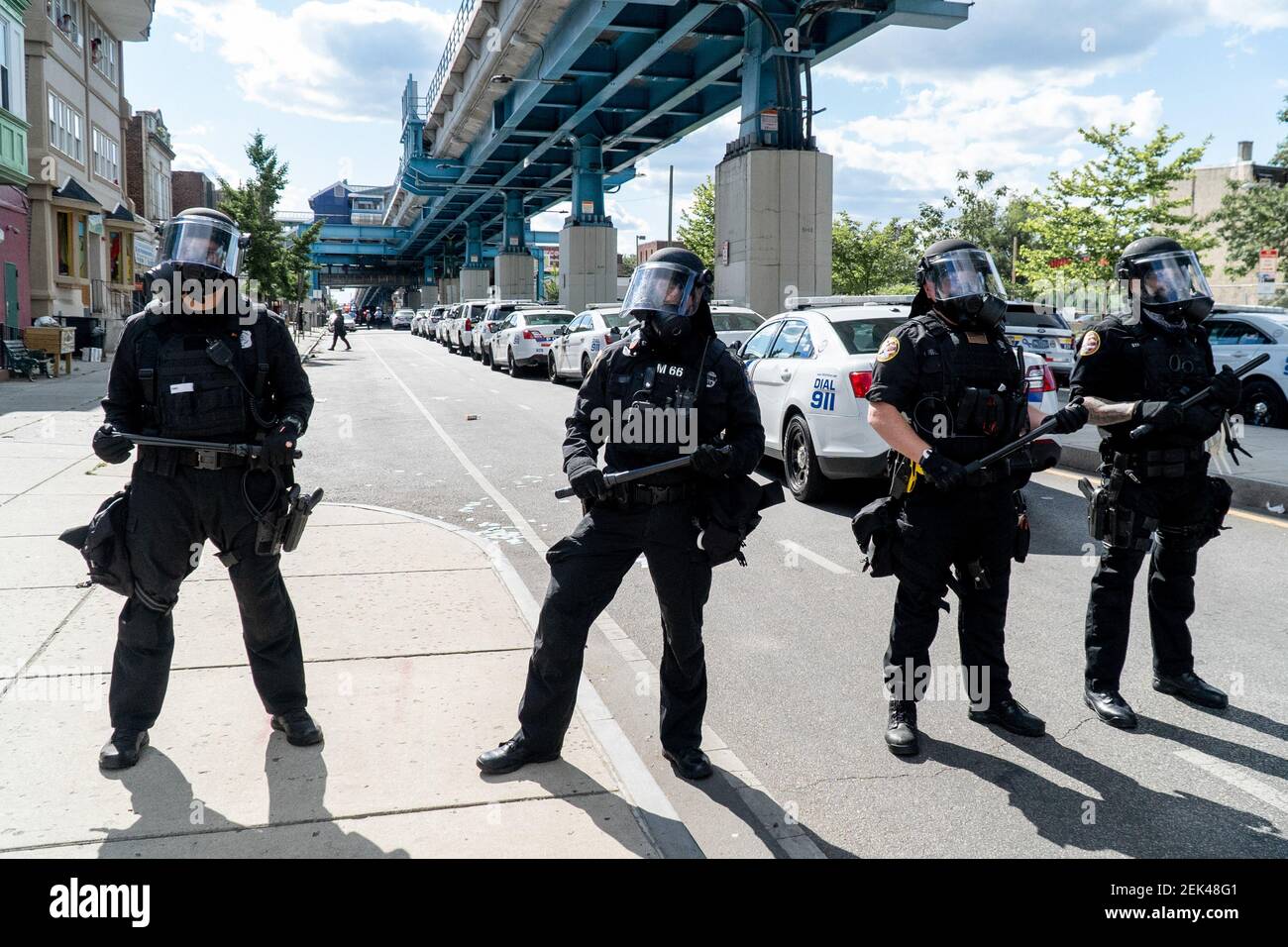 Philadelphia police in riot gear block Market Street after looting and ...