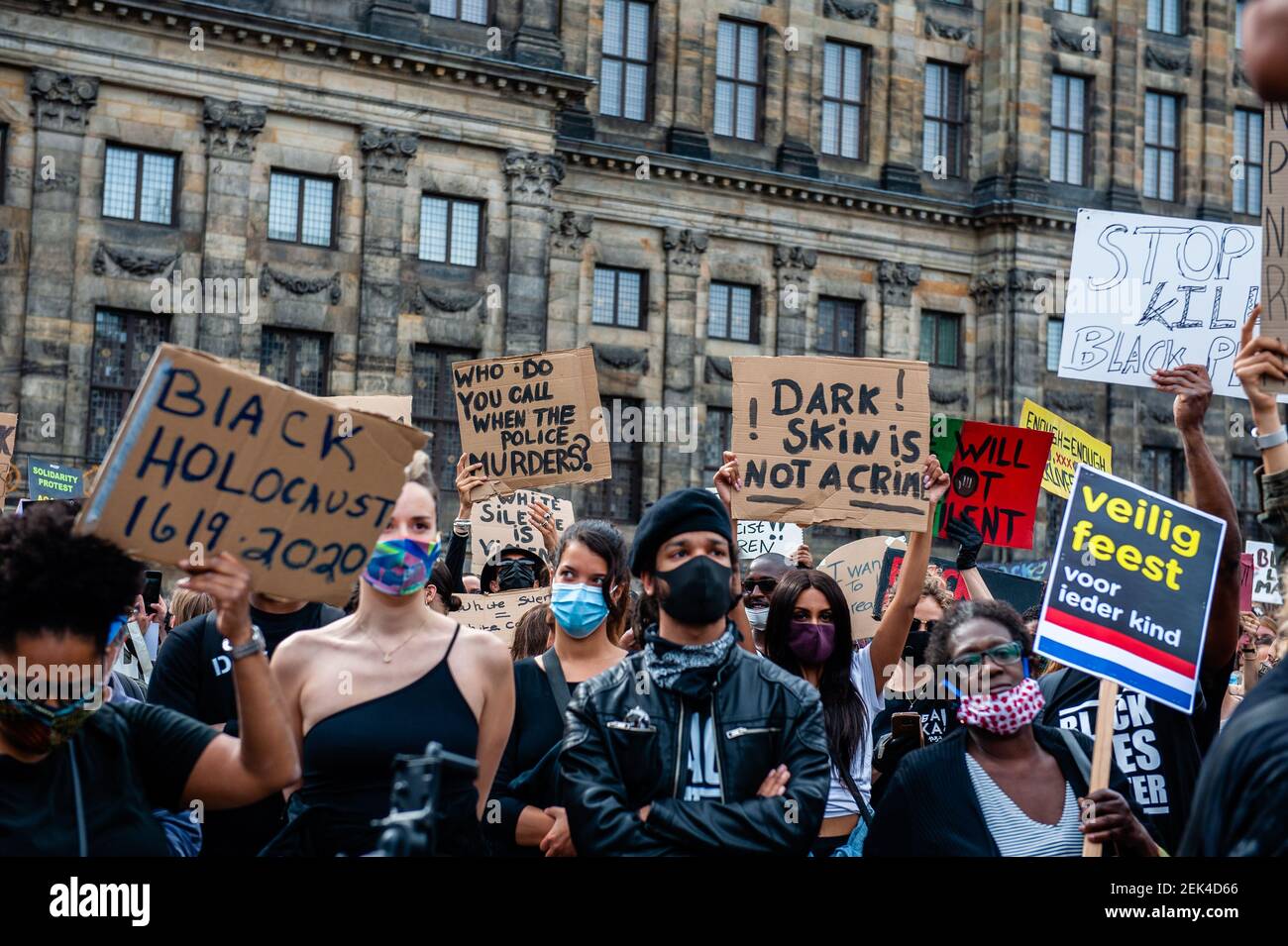 Anti Racism Mask A group of people are holding anti racist placards and wearing mouth ...