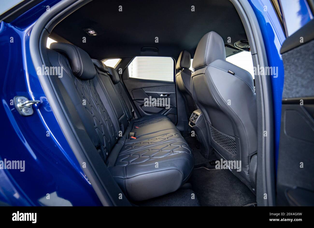 Row of passenger rear seats in blue car Stock Photo