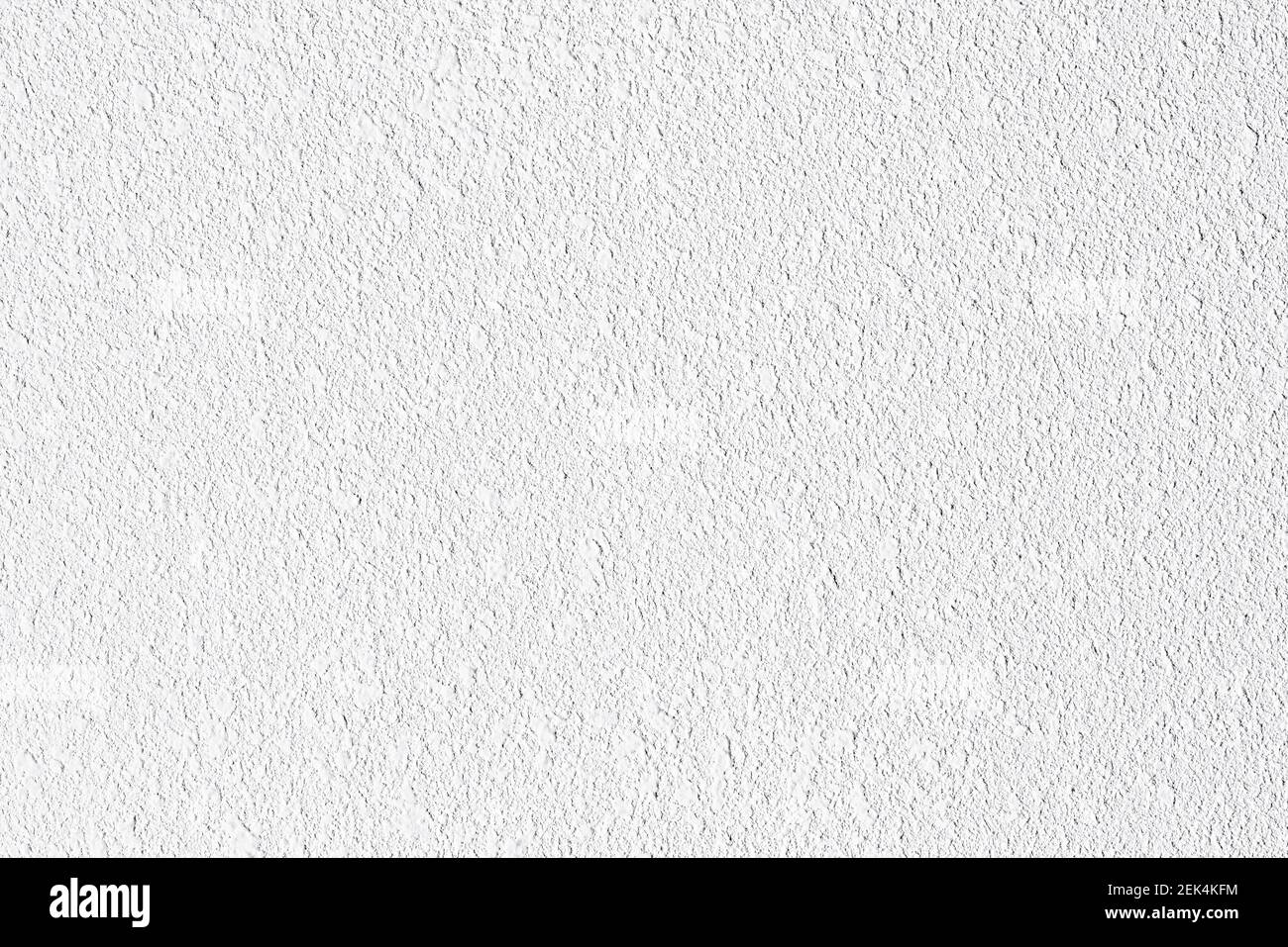 Rough grainy white paint structure background. Grungy light grey texture. Rugged urban pattern for cool abstract effect. Granular grunge surface. Stock Photo