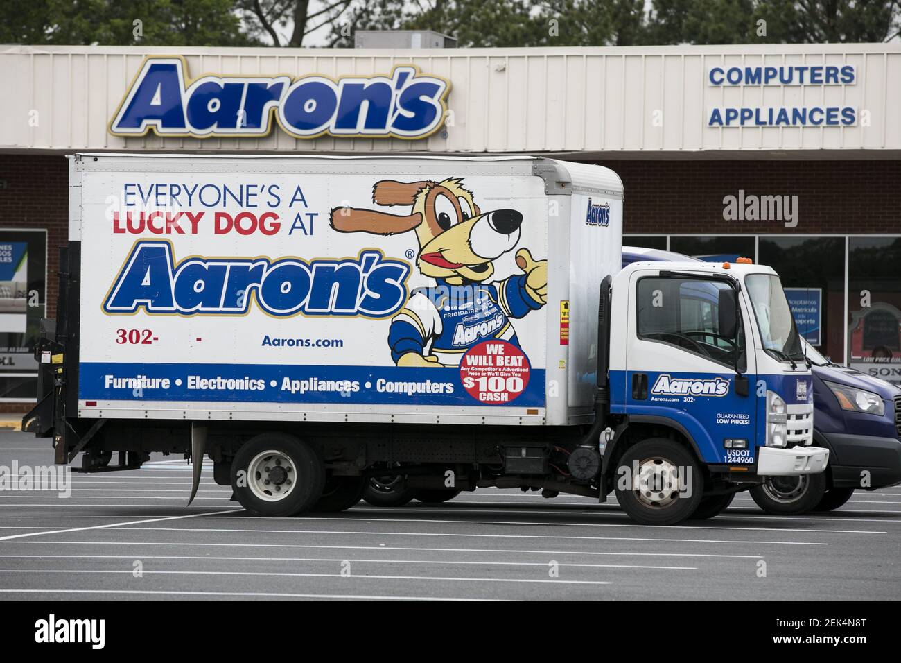 A logo sign outside of a Aaron's rent to own store location in Seaford