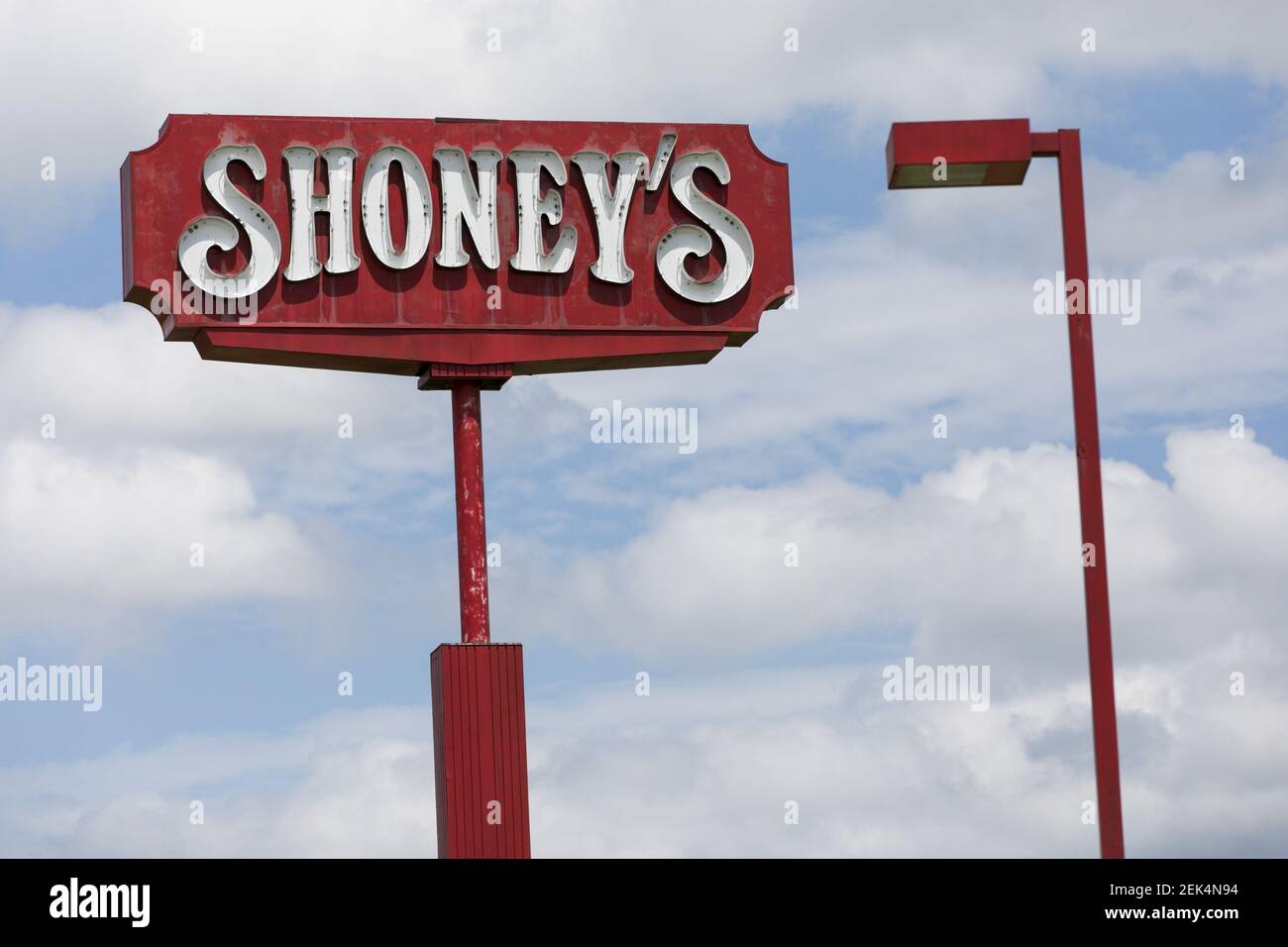 A logo sign outside of a Shoney's restaurant location in Sutton, West