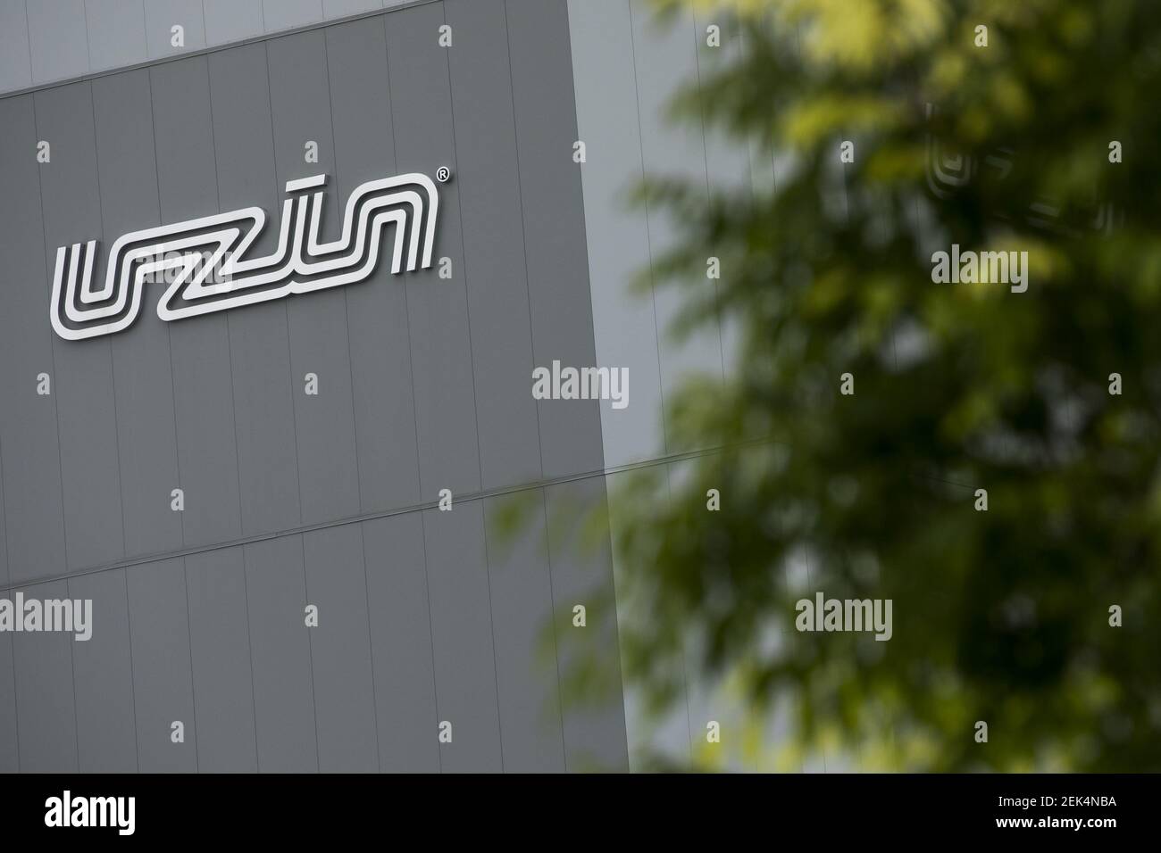 String. Sign Utz A logo sign outside of a facility occupied by Uzin Utz in Dover ...