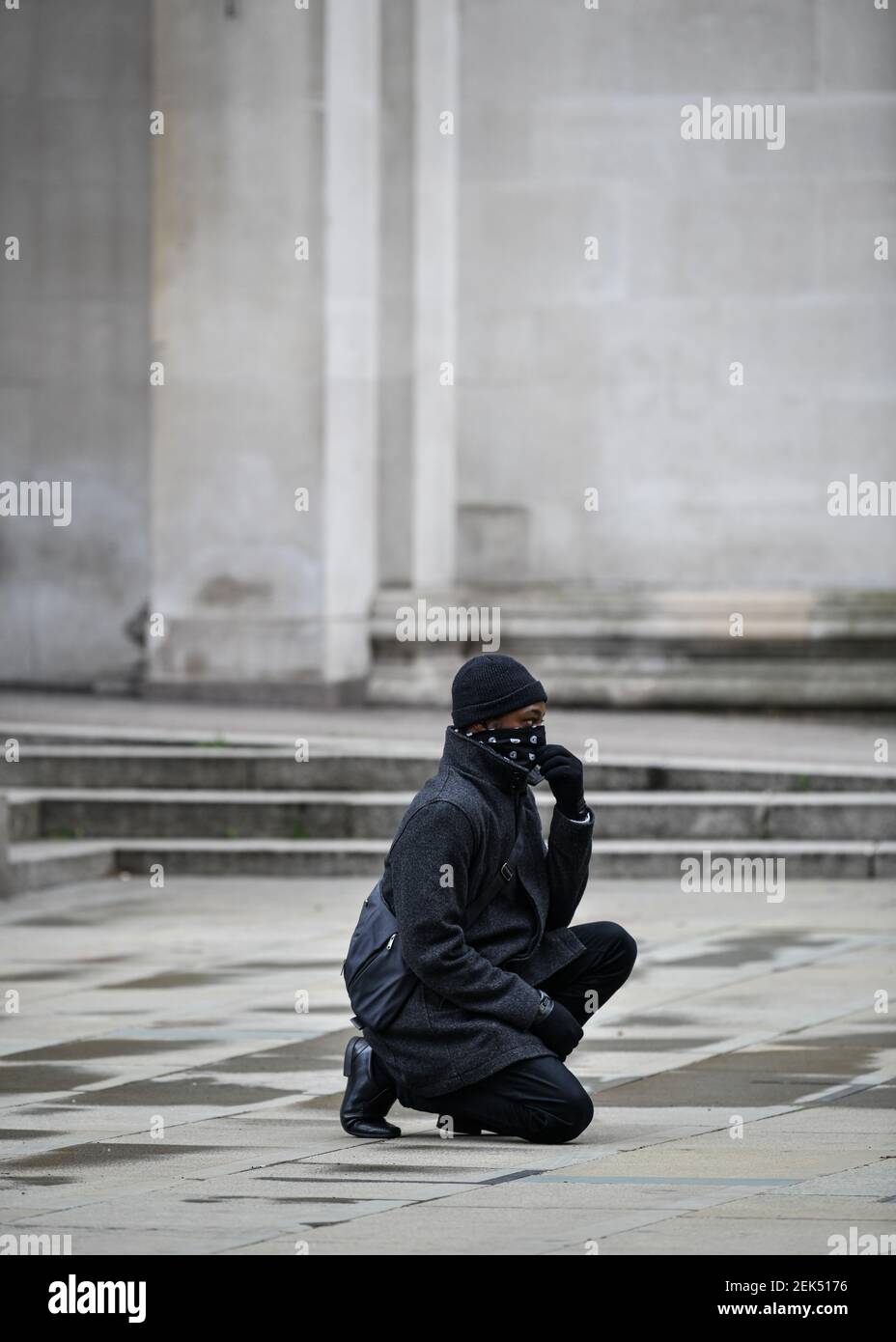A lone protester takes a knee during the demonstration. Hundreds of people together with the members of the Fire & Rescue service took to the streets in solidarity with the Black Lives Matter march following the killing of George Floyd, a black man who died in police custody in Minneapolis. (Photo by Kenny Brown / SOPA Images/Sipa USA)  Stock Photo