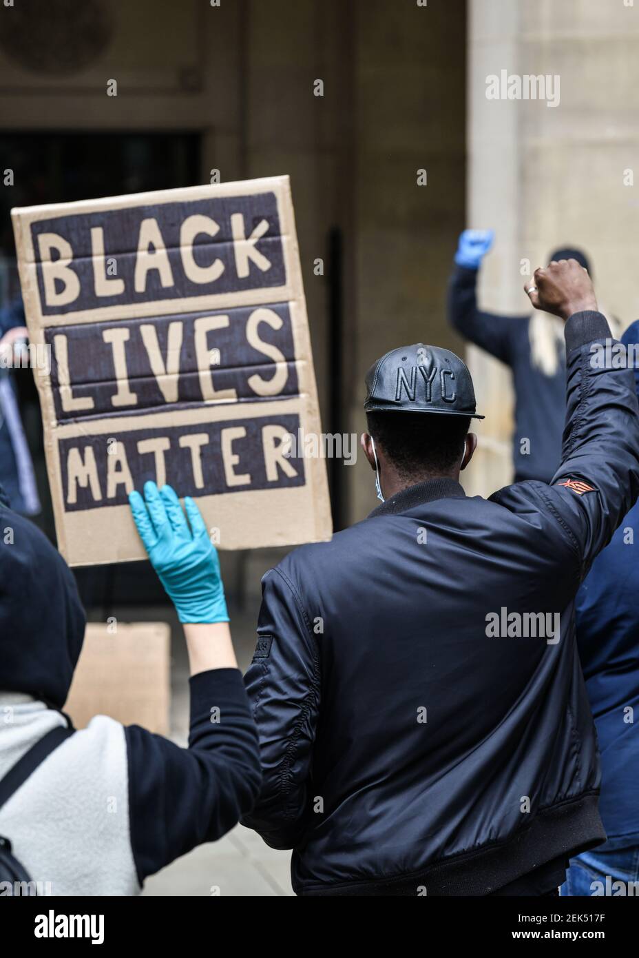 A protesters holds a placard that says Black lives matter during the demonstration. Hundreds of people together with the members of the Fire & Rescue service took to the streets in solidarity with the Black Lives Matter march following the killing of George Floyd, a black man who died in police custody in Minneapolis. (Photo by Kenny Brown / SOPA Images/Sipa USA)  Stock Photo