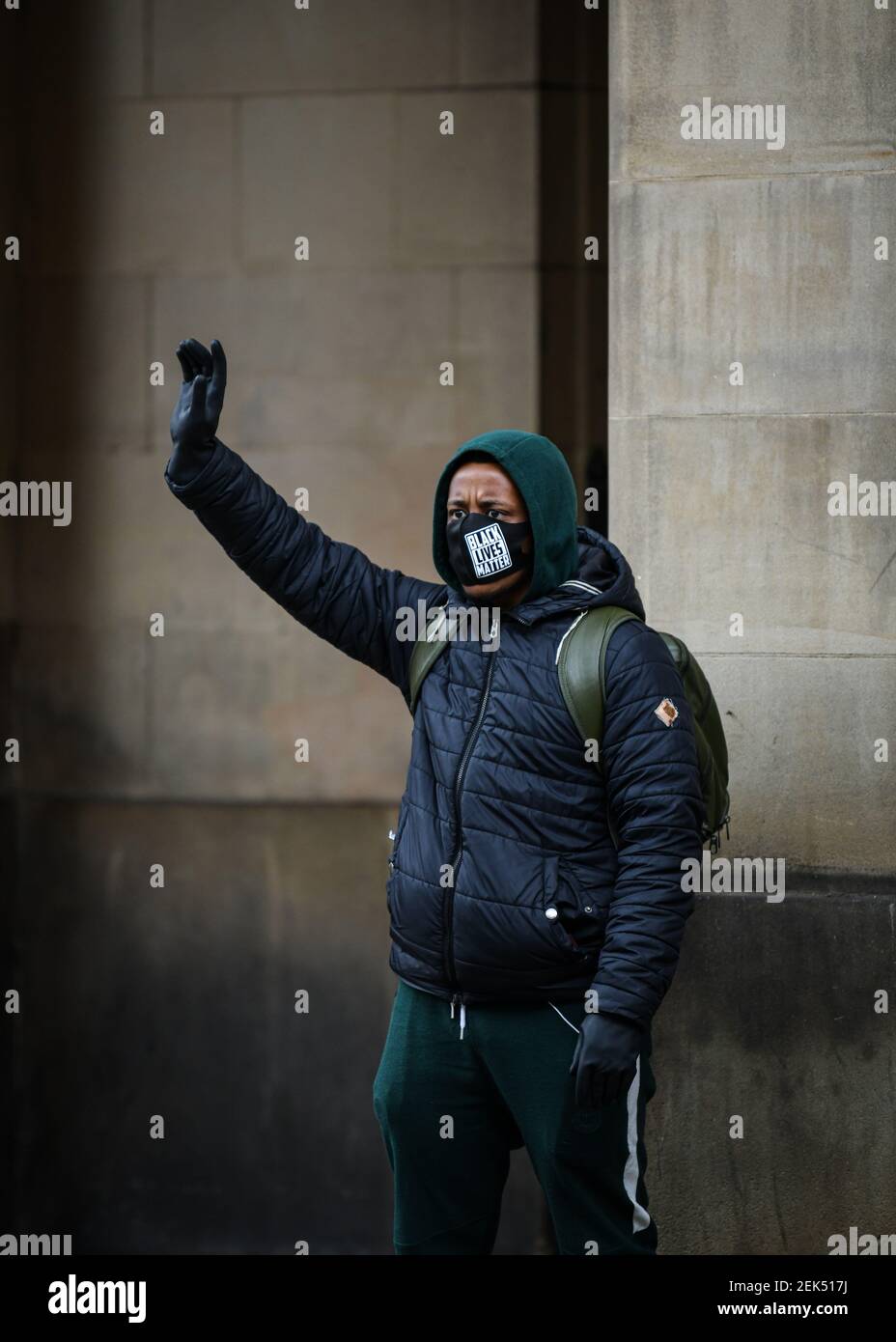 A protester holds up his fist during the demonstration. Hundreds of people together with the members of the Fire & Rescue service took to the streets in solidarity with the Black Lives Matter march following the killing of George Floyd, a black man who died in police custody in Minneapolis. (Photo by Kenny Brown / SOPA Images/Sipa USA)  Stock Photo