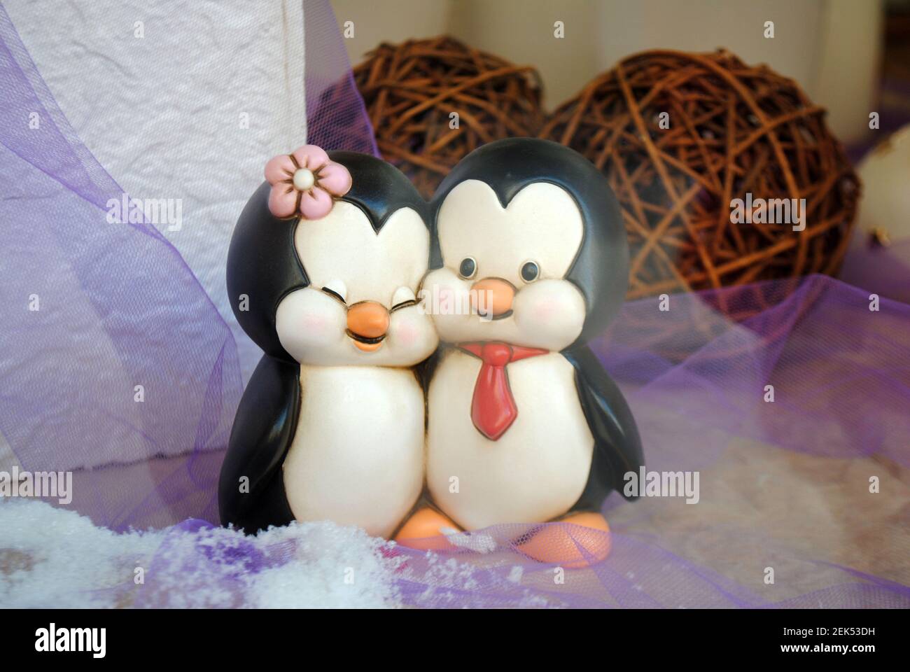 A penguin couple statuette depicting the feeling of love. Stock Photo