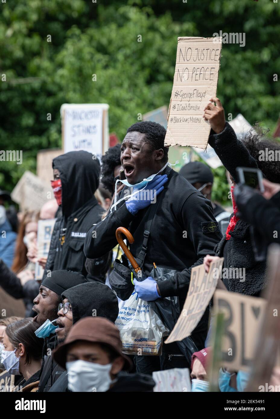 A protester holds his throat while shouting I can’t Breathe during the demonstration. Thousands of people attend the most recent 'Black Lives Matter' protest in Manchester's city centre following the death of George Floyd in the USA. (Photo by Kenny Brown / SOPA Images/Sipa USA)  Stock Photo