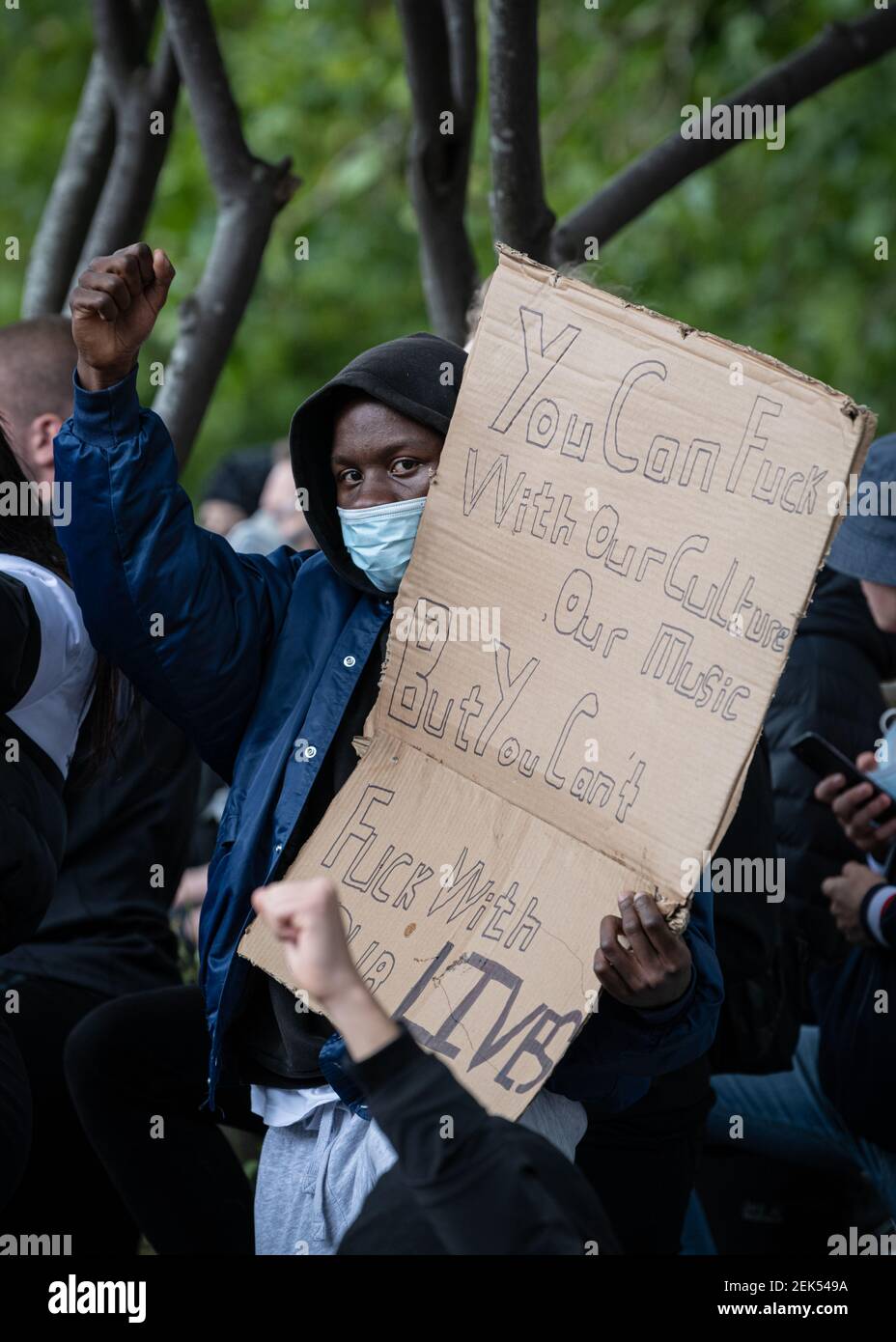 A protester holding a BLM placard during the demonstration. Thousands of people attend the most recent 'Black Lives Matter' protest in Manchester's city centre following the death of George Floyd in the USA. (Photo by Kenny Brown / SOPA Images/Sipa USA)  Stock Photo