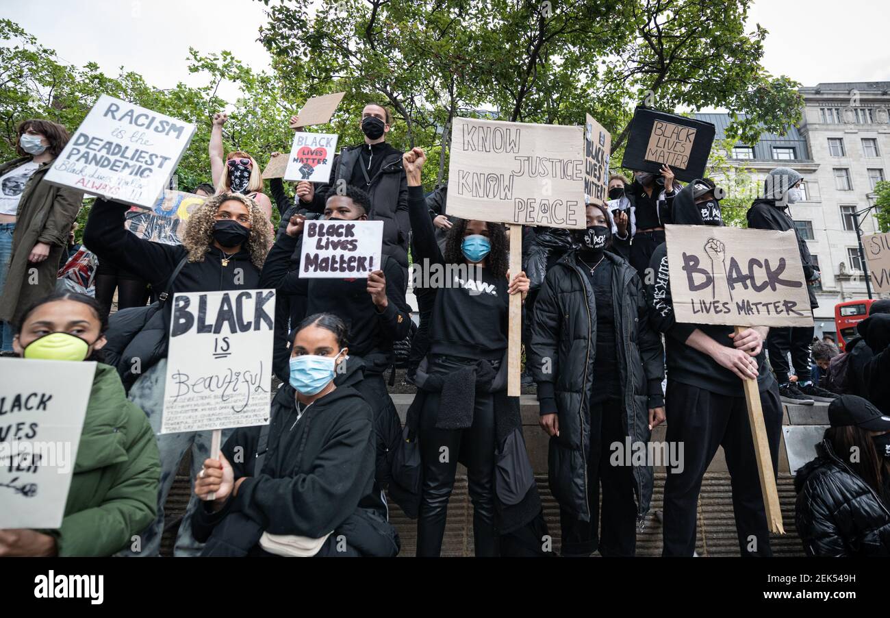 Protesters hold BLM placards during the demonstration. Thousands of people attend the most recent 'Black Lives Matter' protest in Manchester's city centre following the death of George Floyd in the USA. (Photo by Kenny Brown / SOPA Images/Sipa USA)  Stock Photo