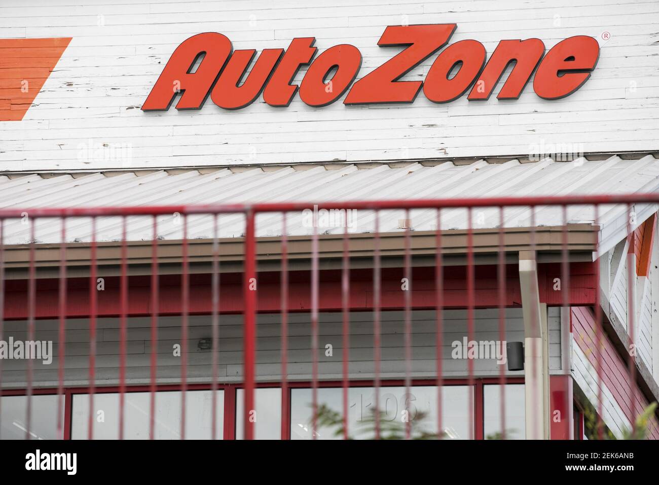 A logo sign outside of a AutoZone retail store location in Frederick
