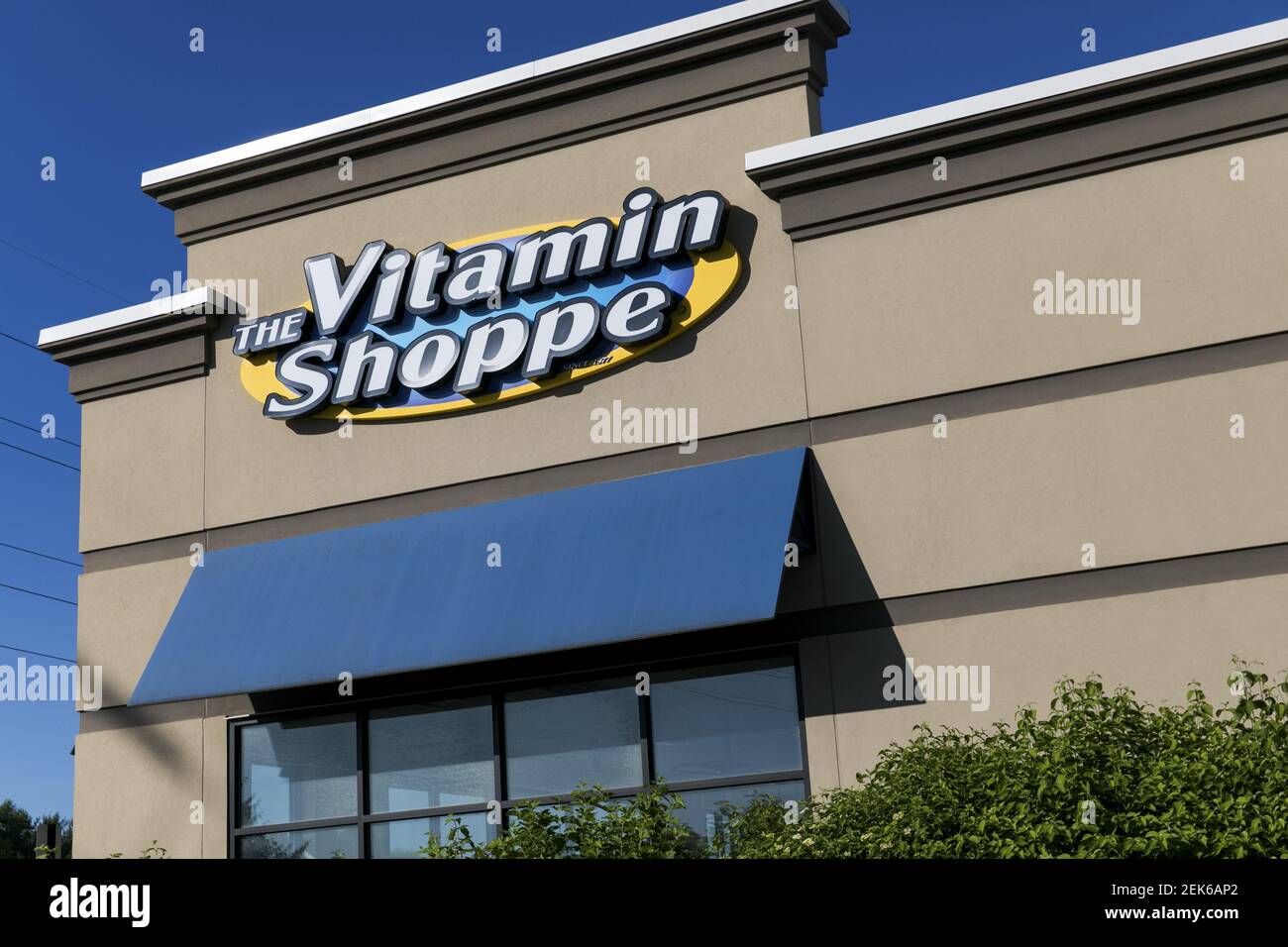 A logo sign outside of a The Vitamin Shoppe retail store location in