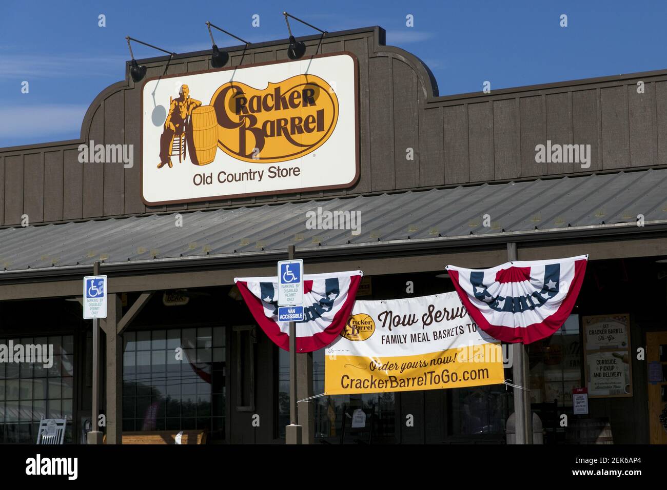 A logo sign outside of a Cracker Barrel Old Country Store restaurant