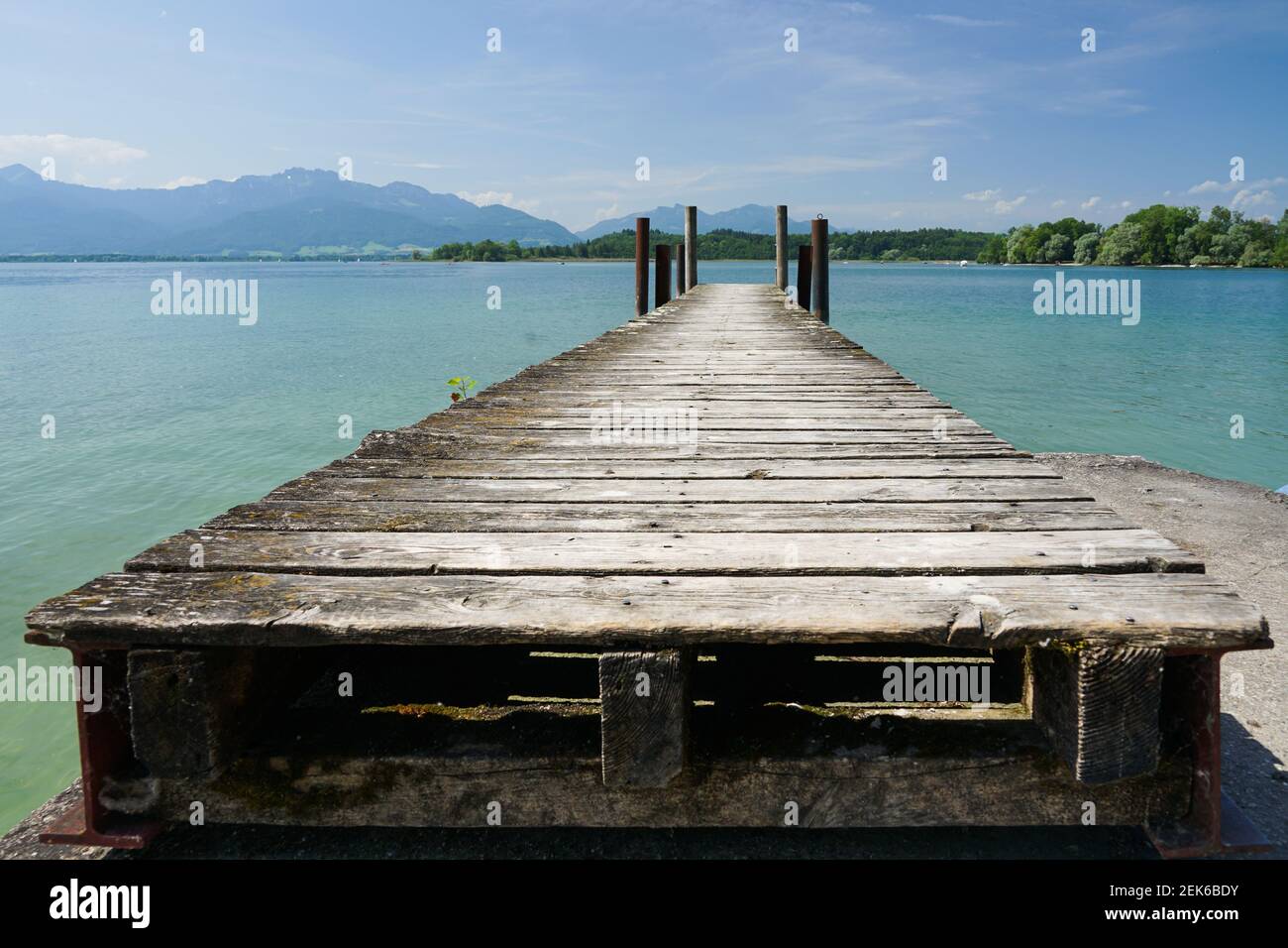 Weathered landing stage shot from low angle with lines converging on the horizon Stock Photo