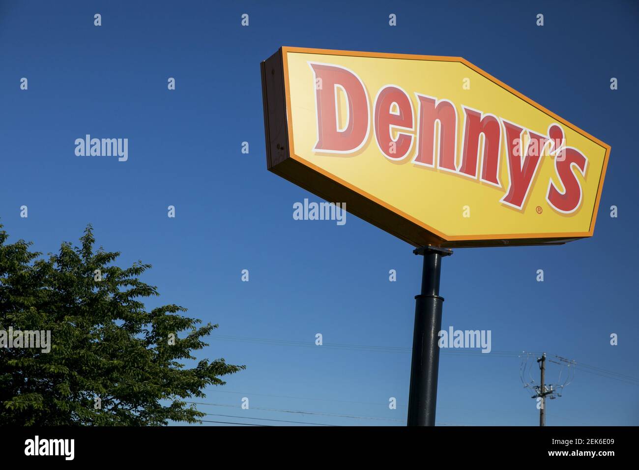 A logo sign outside of a Denny's restaurant location in Hanover ...