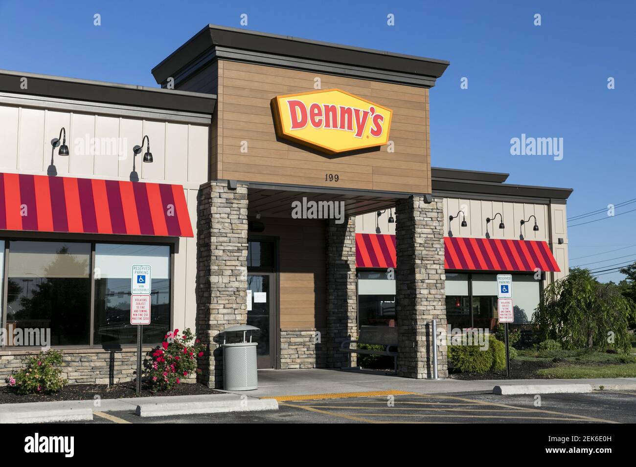 A logo sign outside of a Denny's restaurant location in Hanover ...