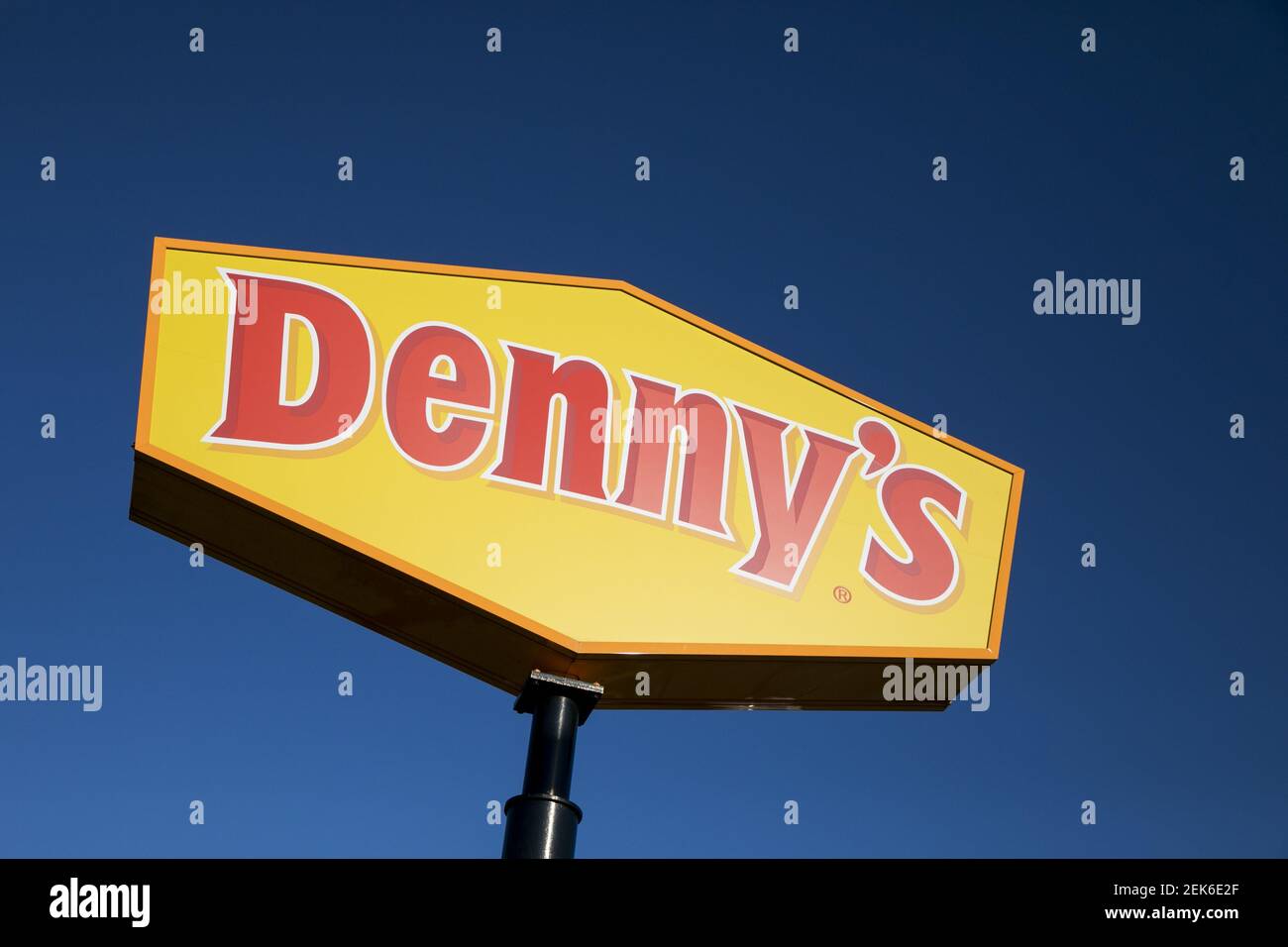 A logo sign outside of a Denny's restaurant location in Hanover