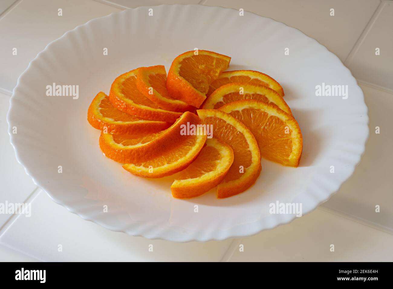 close up of fresh oranges slices on a plate Stock Photo