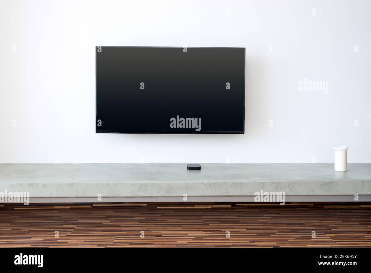 flat TV screen on white wall Stock Photo Alamy