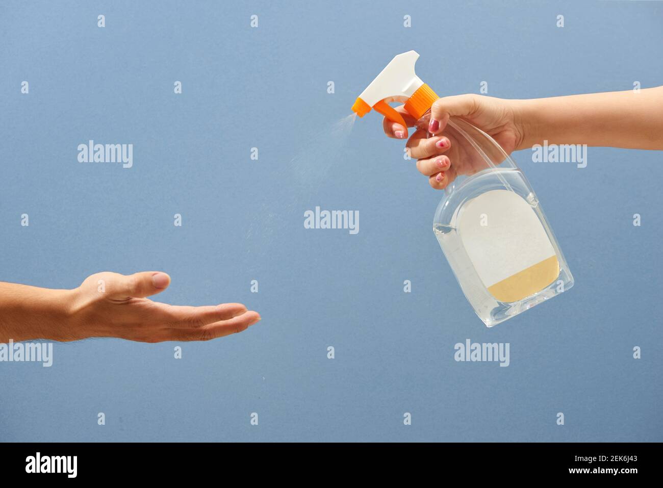 Spraying Antivirus Sanitizer Spray, Hand Sanitizer Dispenser, infection control concept. Stock Photo