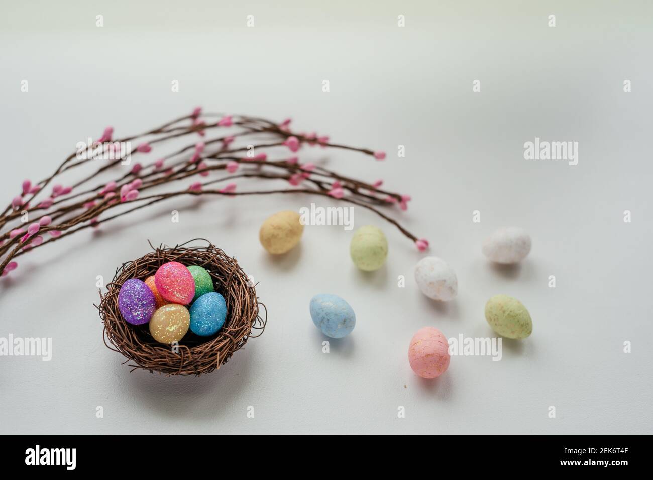 Colorful Easter eggs in bird #39 s nest with Easter decorative branches on Colorful Easter eggs in bird #39 s nest with Easter decorative branches on
