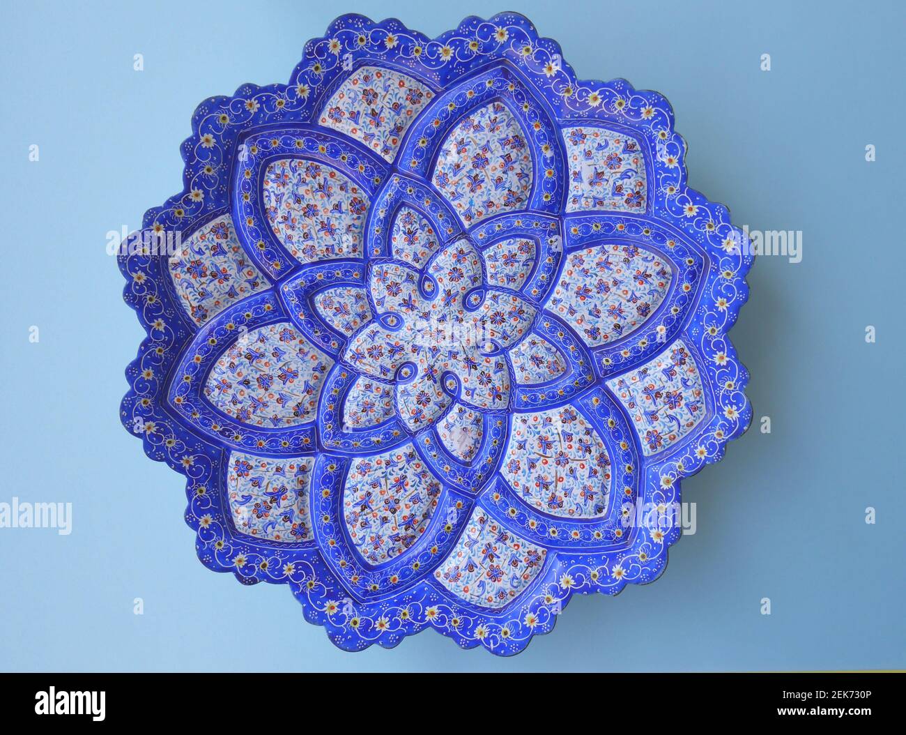Blue, turquoise enameled metal plate from Iran, Persia Stock Photo