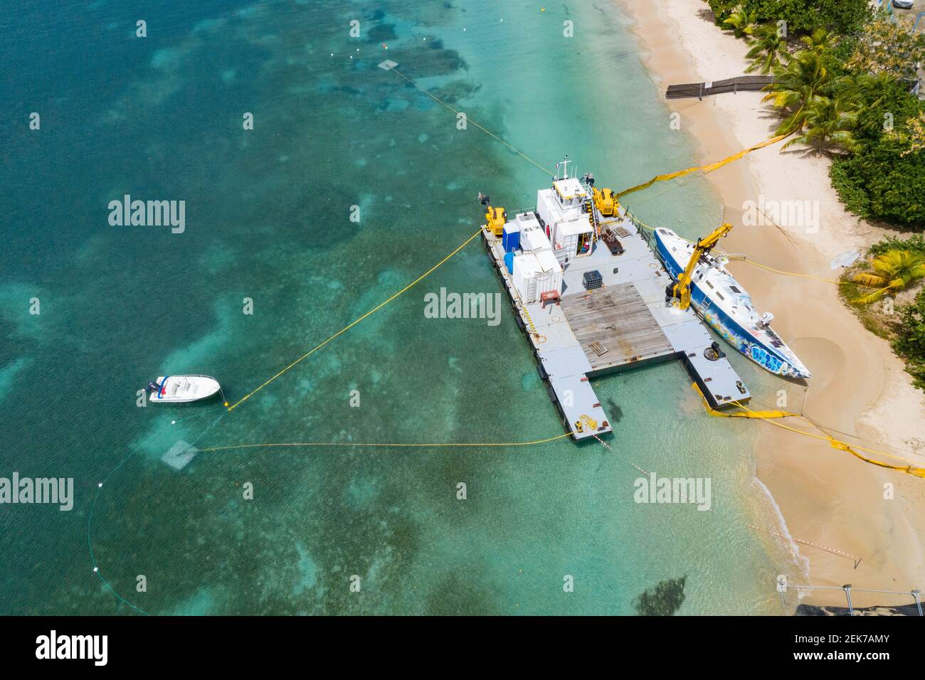 Dismantling of the Miss Carole boat stranded on the beach of Sainte-Anne in Martinique since hurricane  Maria in 2017 Stock Photo