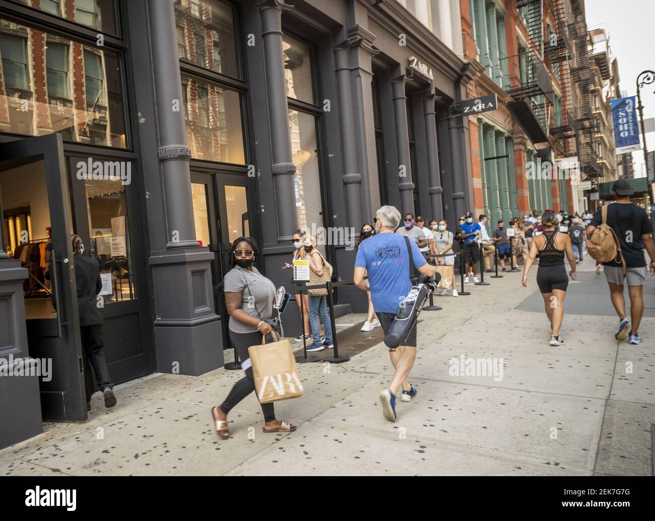 Line outside a Zara store in Soho in New York on Sunday, June 28, 2020 as