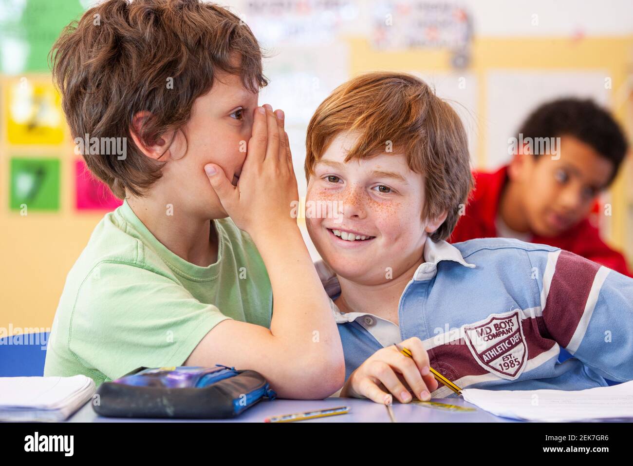 School children talking in a classroom Stock Photo