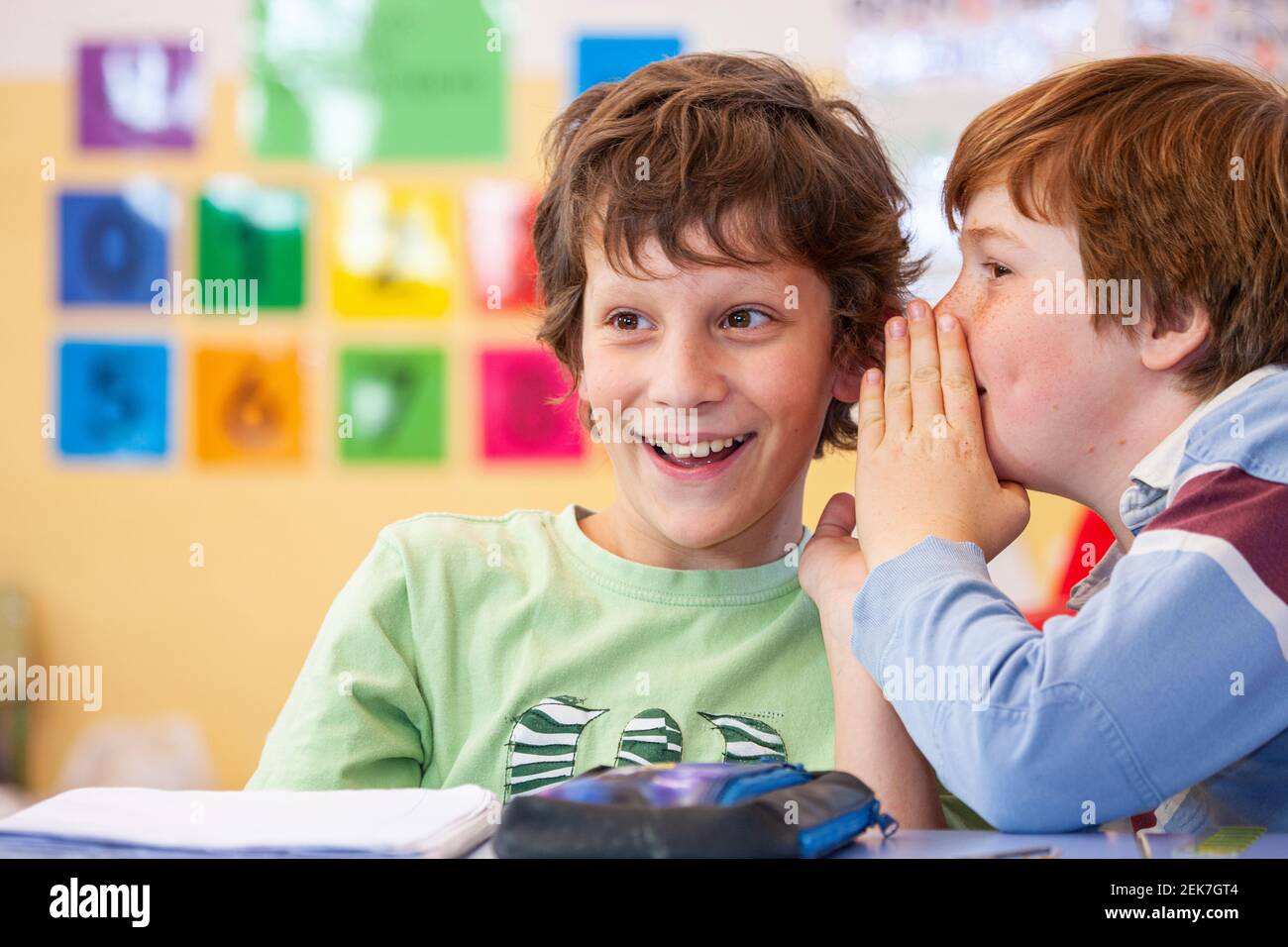 School children talking in a classroom Stock Photo