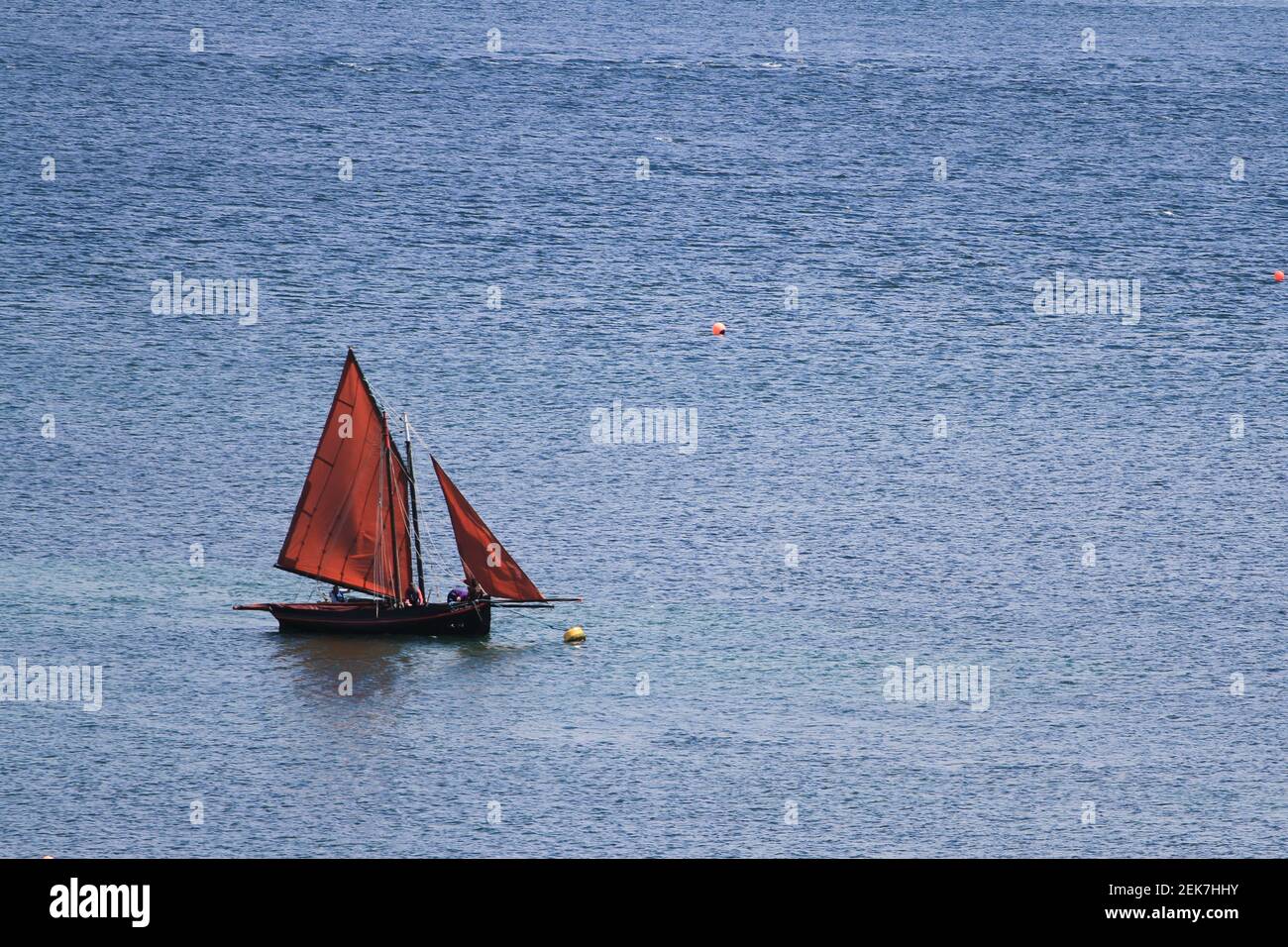 A lone Galway hooker off the Connemara coast, Ireland, during a summer regatta Stock Photo