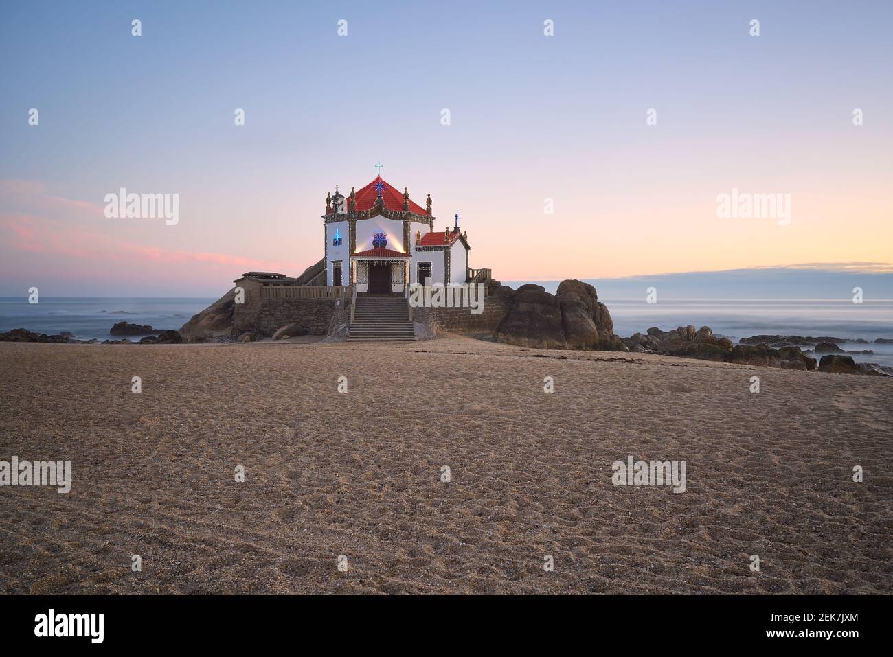 Beautiful chapel on the beach Capela do Senhor da Pedra at sunset in  Miramar, in Portugal Stock Photo - Alamy