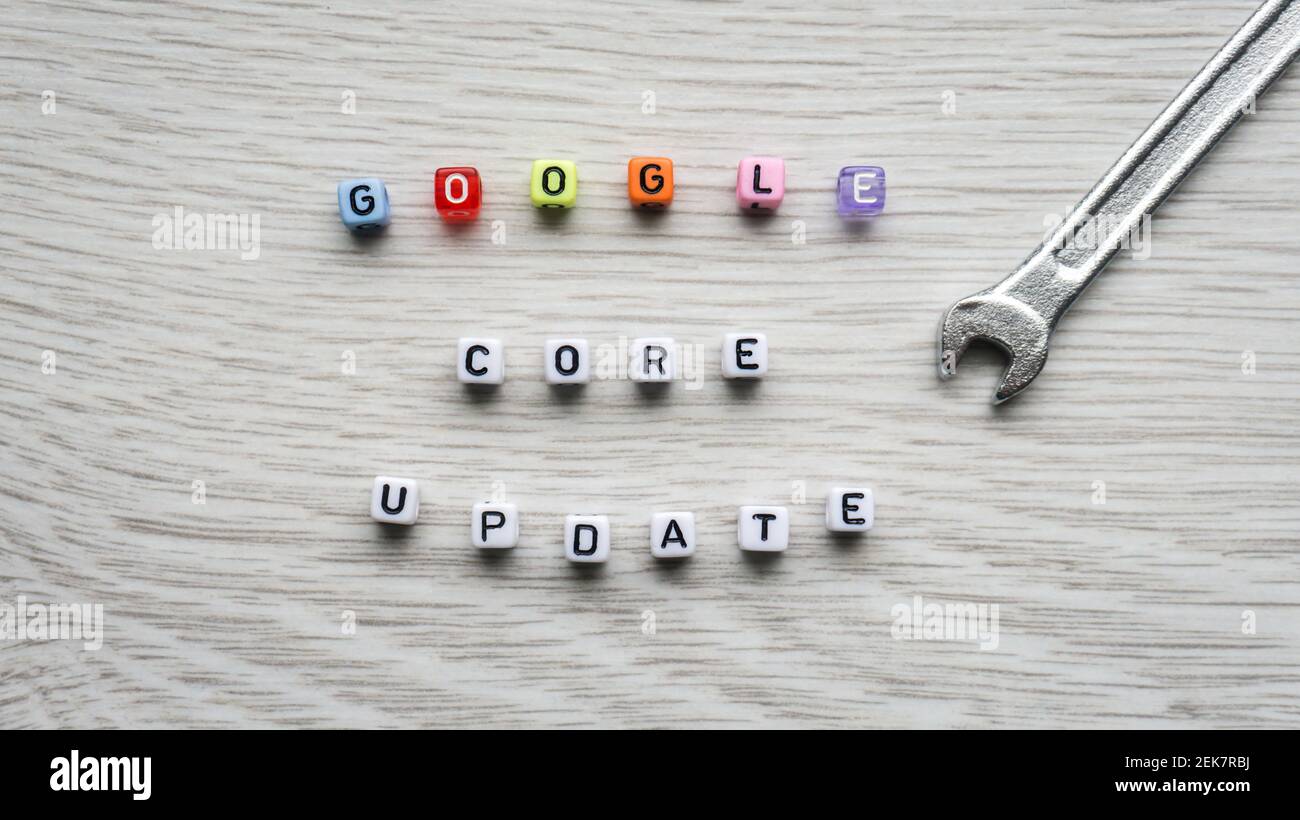 WARSAW, POLAND - JANUARY 27, 2021: Google core update text made with cube beads letters with a wrench. Search engine optimization SEO, Digital Marketing term for Google algorithm update Stock Photo