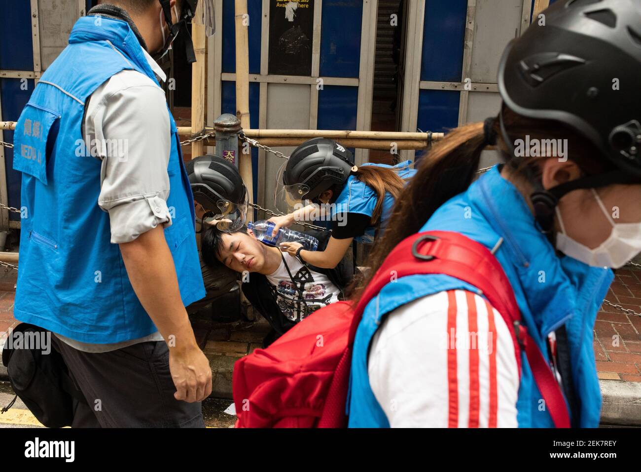 Hong Kong Police Media Liaison Officers treat a Journalist for pepper spray  , in Hong Kong Hong Kong, S.A.R., July 1st, 2020. The HKSAR National  Security Law was passed on 31st June
