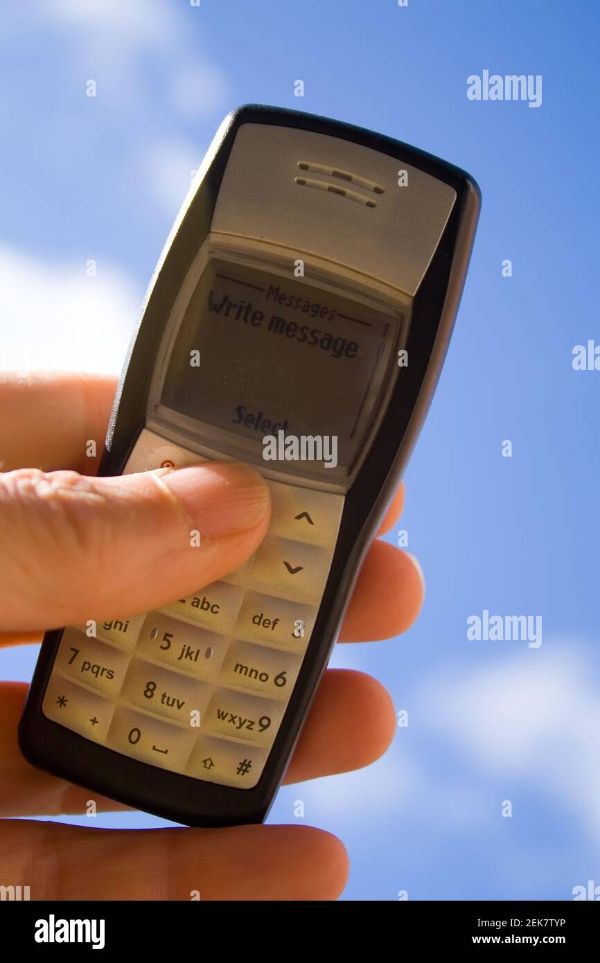 Early Mobile Phone on Sky Background Stock Photo