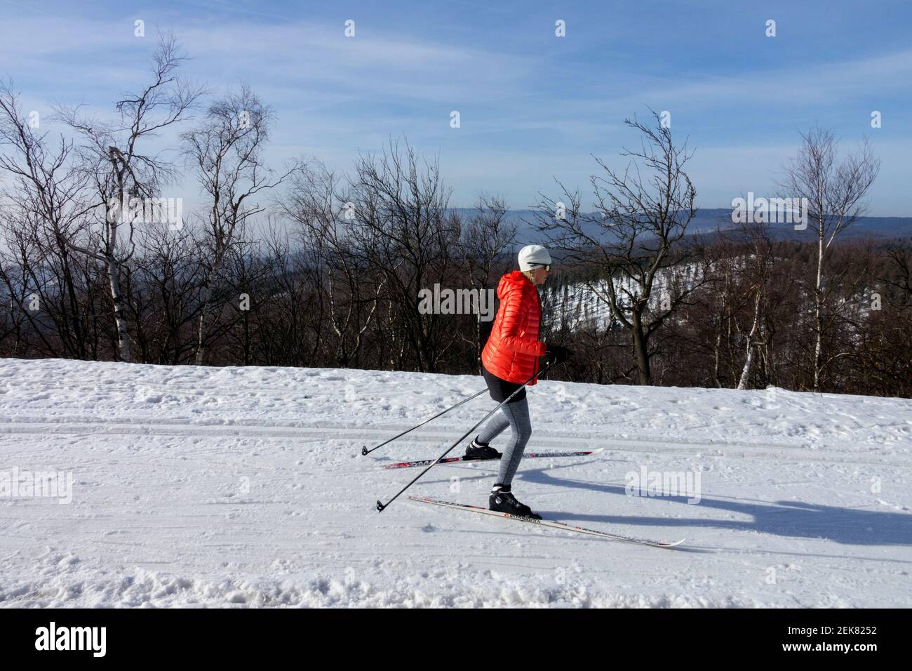 Winter lifestyle woman skiing in landscape Woman skiing alone Stock Photo
