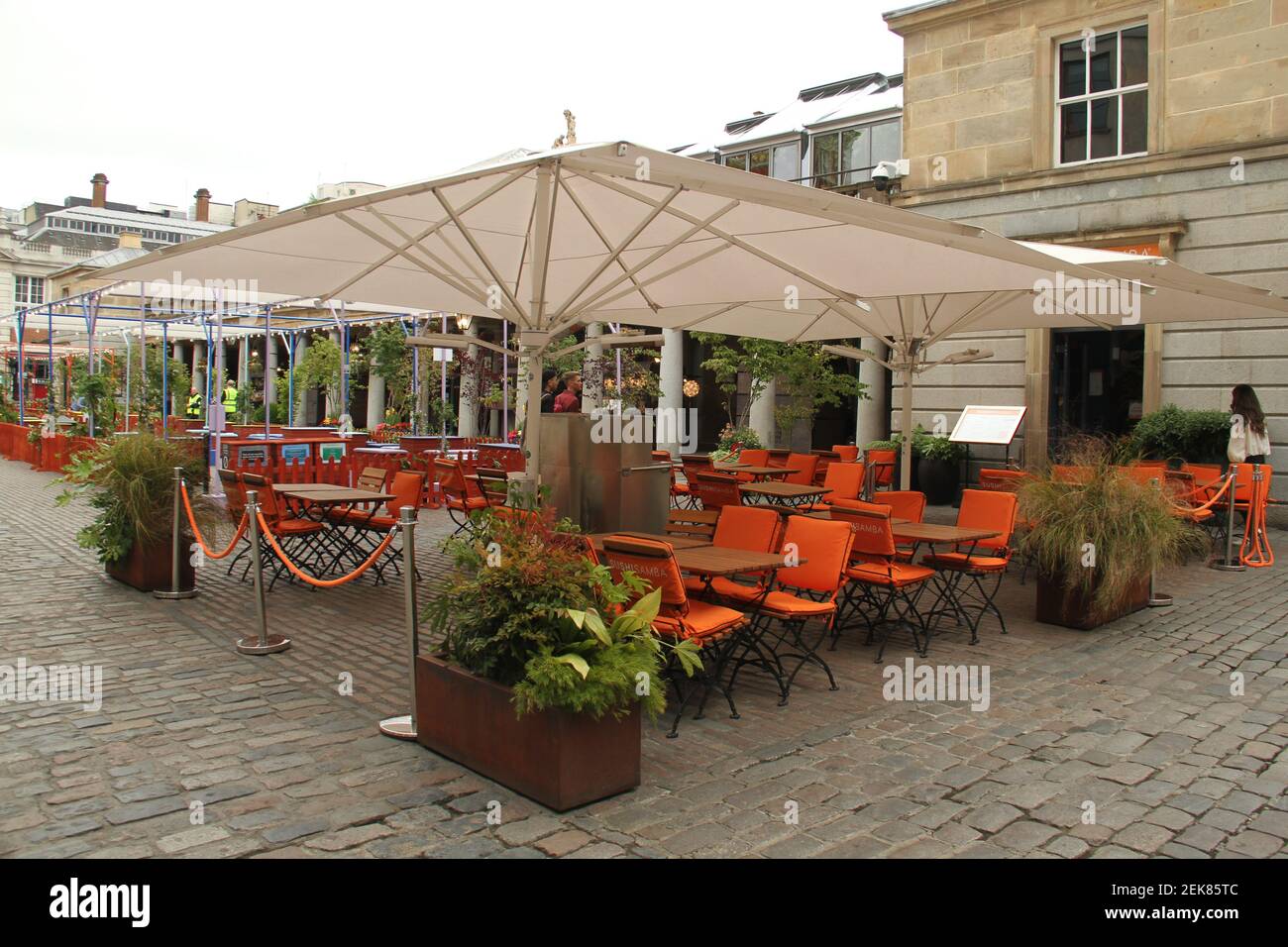A food outlet in Covent Garden sets up an outdoor dining tables. Daily life in London on a Saturday ahead of the opening of pubs on the 4th of July as per new Government advice. (Photo by David Mbiyu / SOPA Images/Sipa USA)  Stock Photo