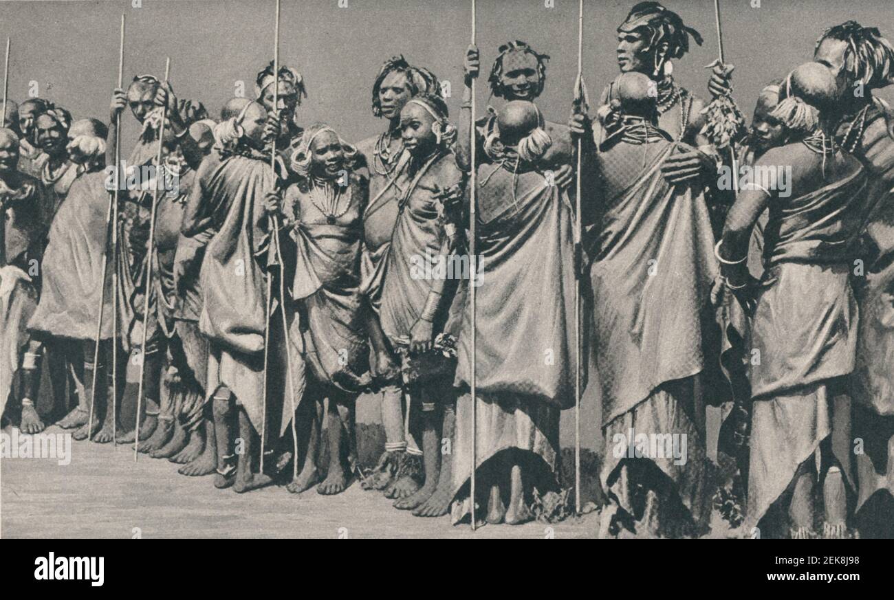 An early 20th century photo of a group of Kikuyu men and women taking part in a ngoma ritual Stock Photo