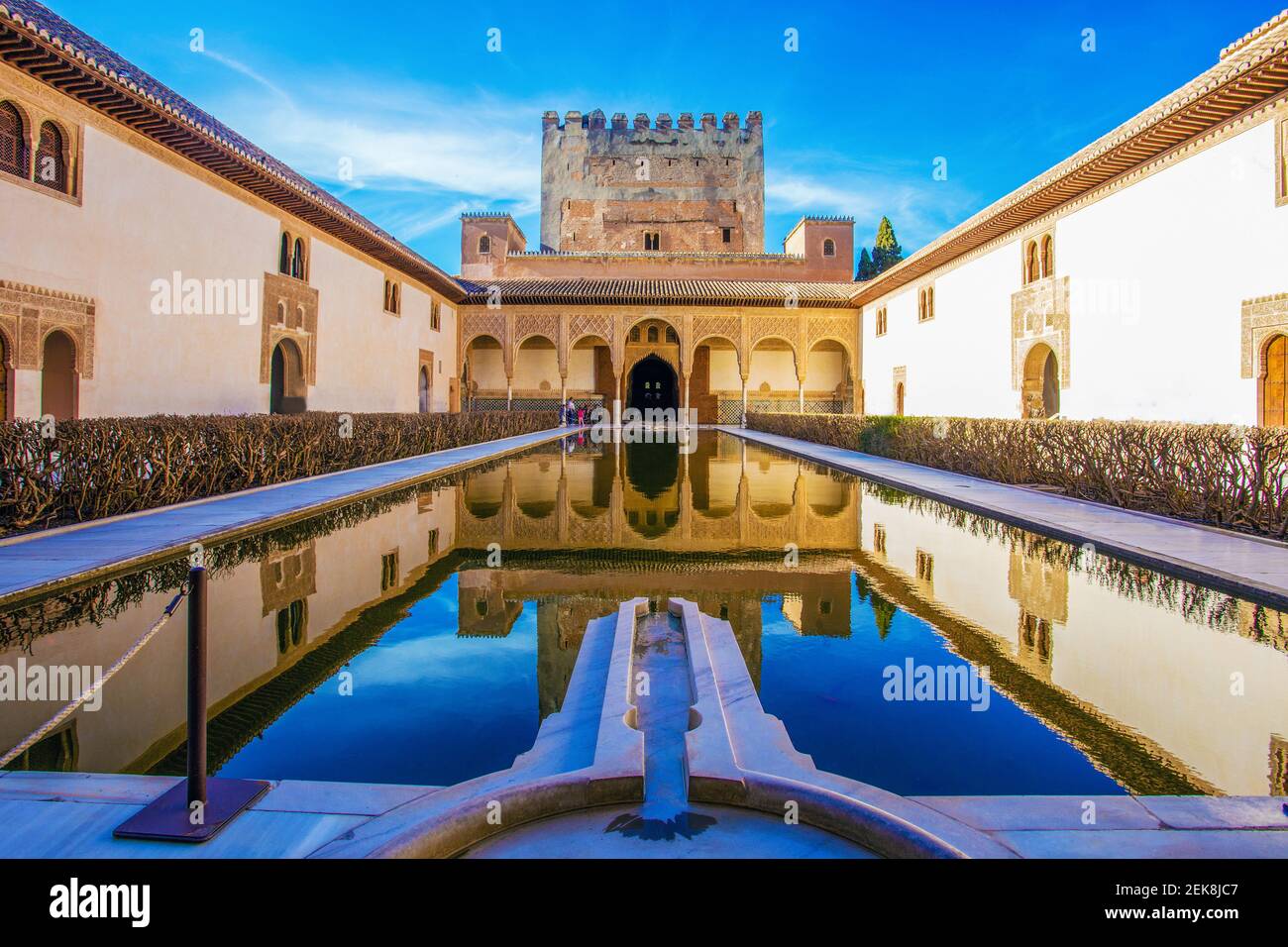 Myrtle courtyard in Alhambra complex bilding with common fortreee wall
