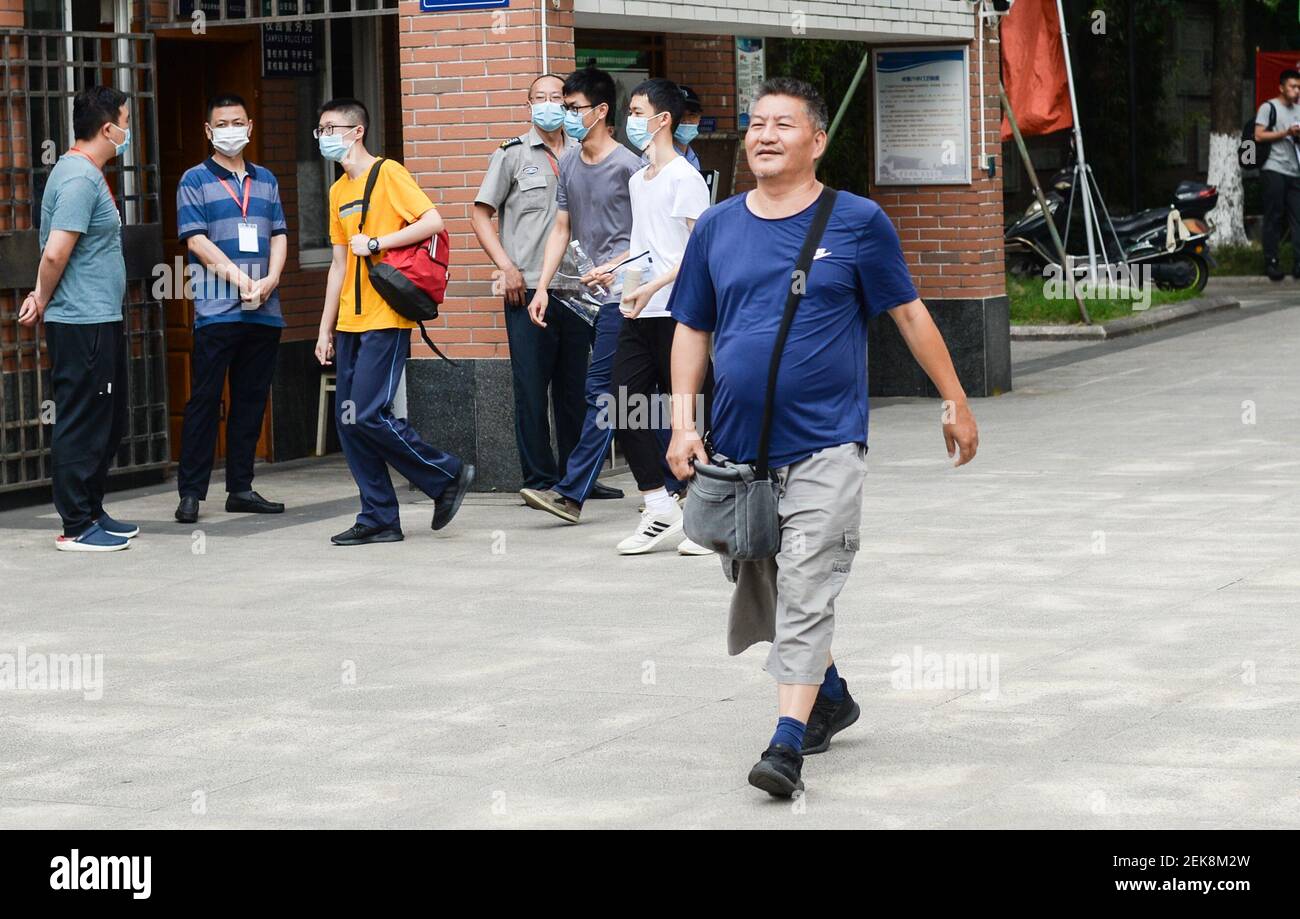 53-year-old Chinese man Liang Shi steps out of the testing center ...