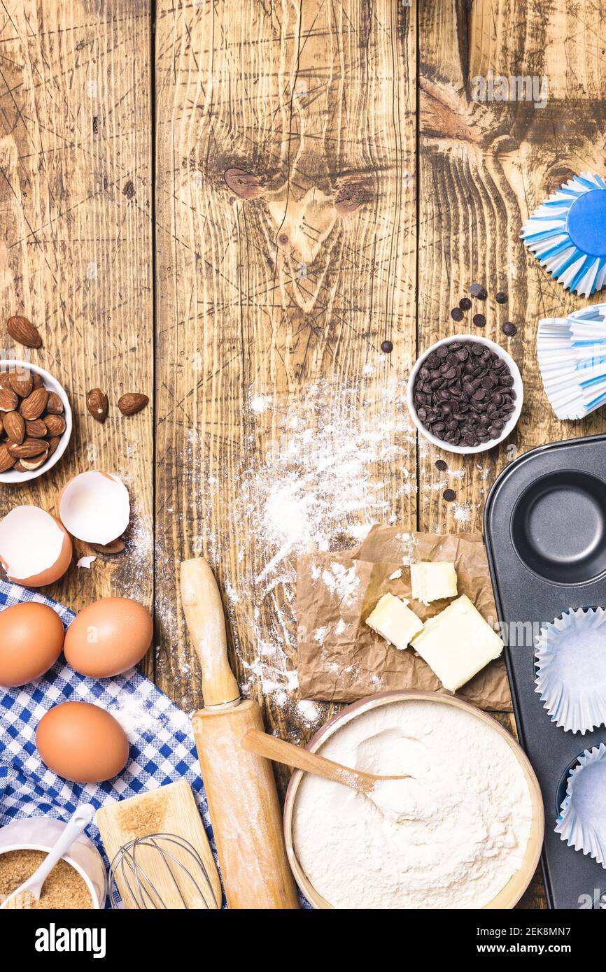 Frame of baking and cooking pastry or cake with ingredients and utensils.  Flour, sugar, eggs, butter and almonds on rustic wooden background with  copy Stock Photo - Alamy