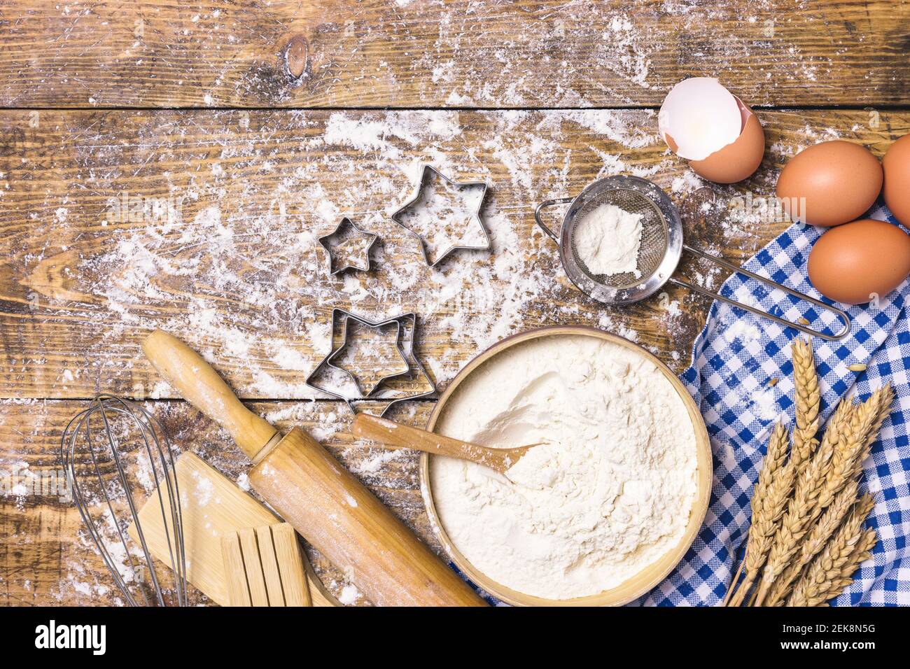 https://c8.alamy.com/comp/2EK8N5G/frame-of-baking-and-cooking-pastry-or-cake-with-ingredients-and-utensils-eggs-flour-and-wheat-on-rustic-wooden-background-with-copy-space-for-text-2EK8N5G.jpg
