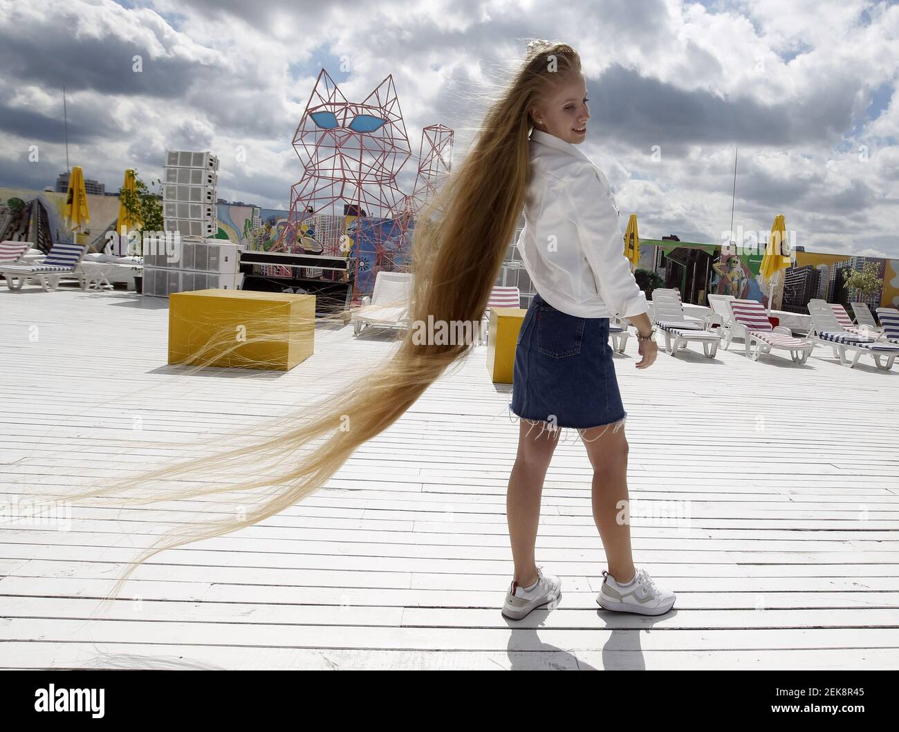 Olena Korzenyuk,17, who is a record holder for teenager with the longest  hair in Ukraine, shows her  m long hair during an event of the National  Registry of Records. Olena Korzenyuk