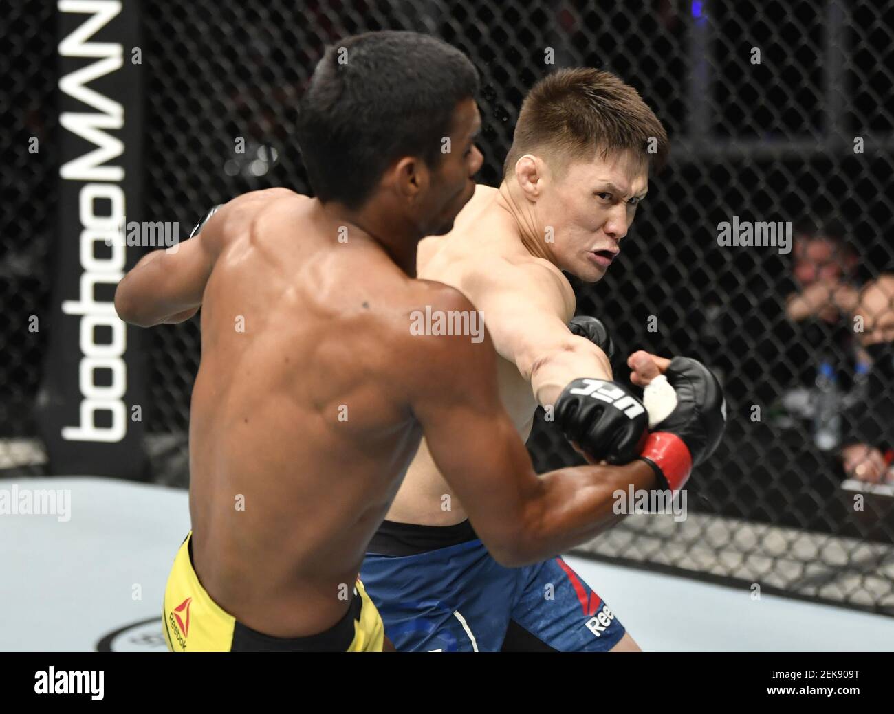 July 12 Abu Dhabi Uae Zhalgas Zhumagulov Of Kazakhstan Punches Raulian Paiva Of Brazil In Their Flyweight Fight During The Ufc 251 Event At Flash Forum On Ufc Fight Island On