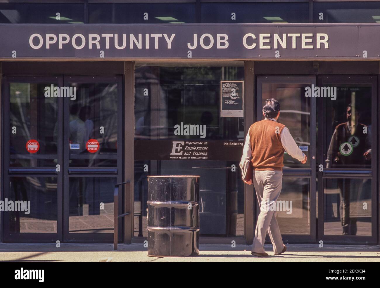 BOSTON, MASSACHUSETTS, USA - Man enters Opportunity Job Center. Stock Photo