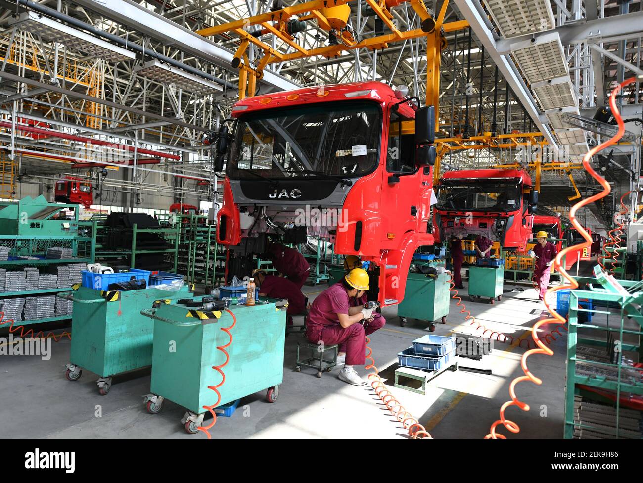FUYANG, CHINA - JULY 16, 2020 - Technical workers assemble trucks on ...
