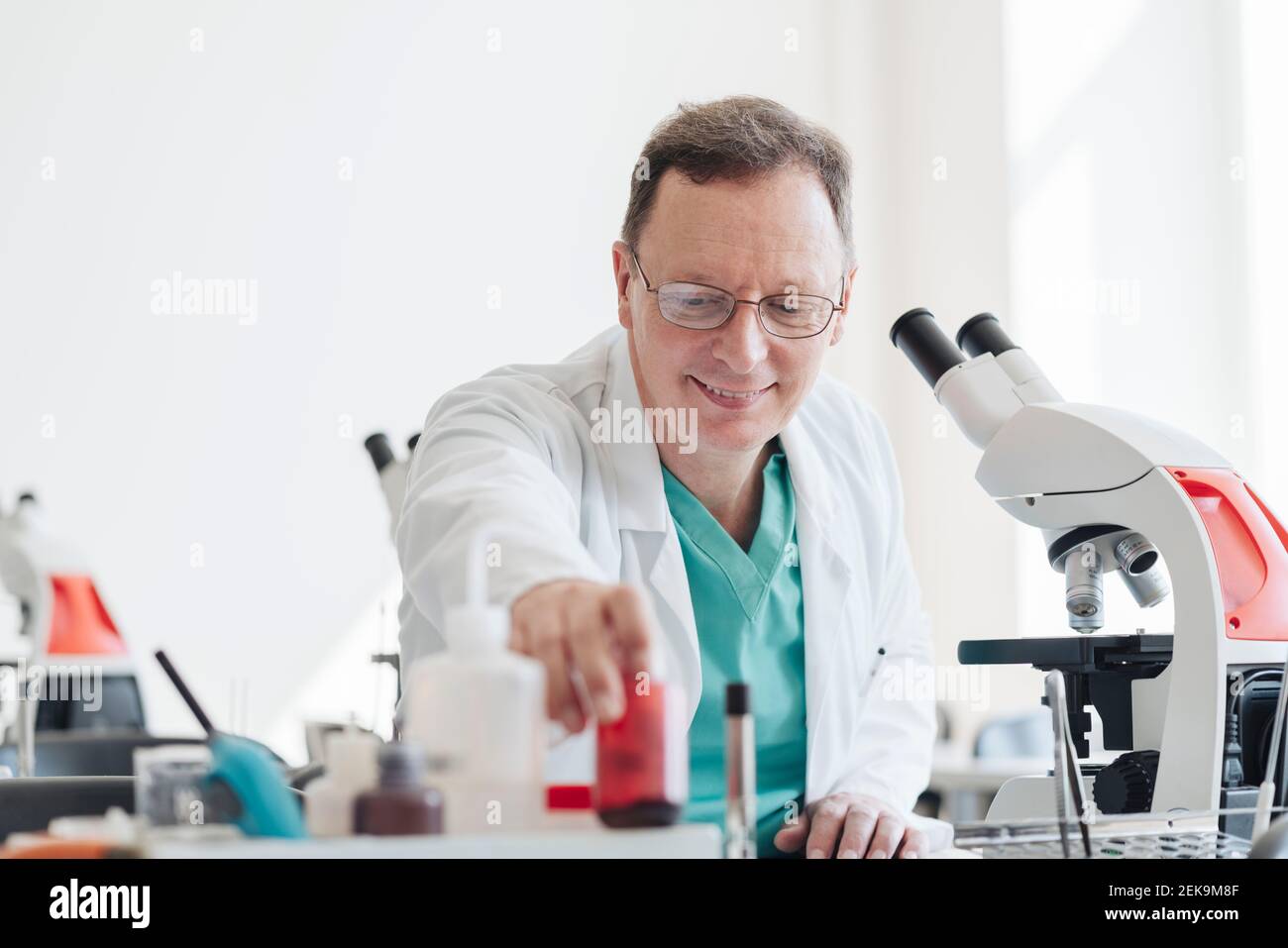 Senior researcher working in lab Stock Photo