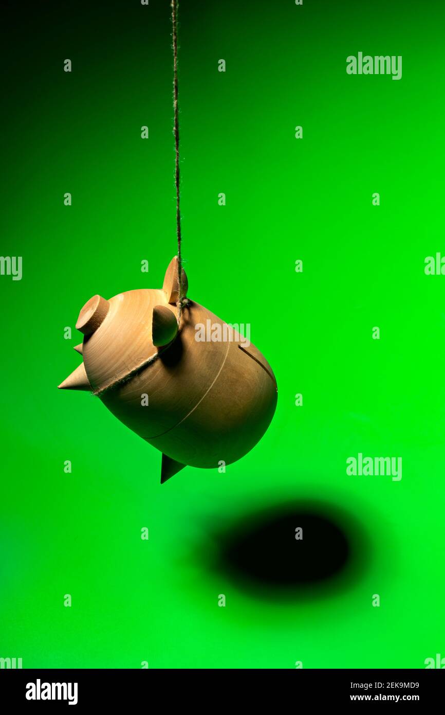 Hanging piggy bank representing economic crisis caused by COVID-19 Stock Photo