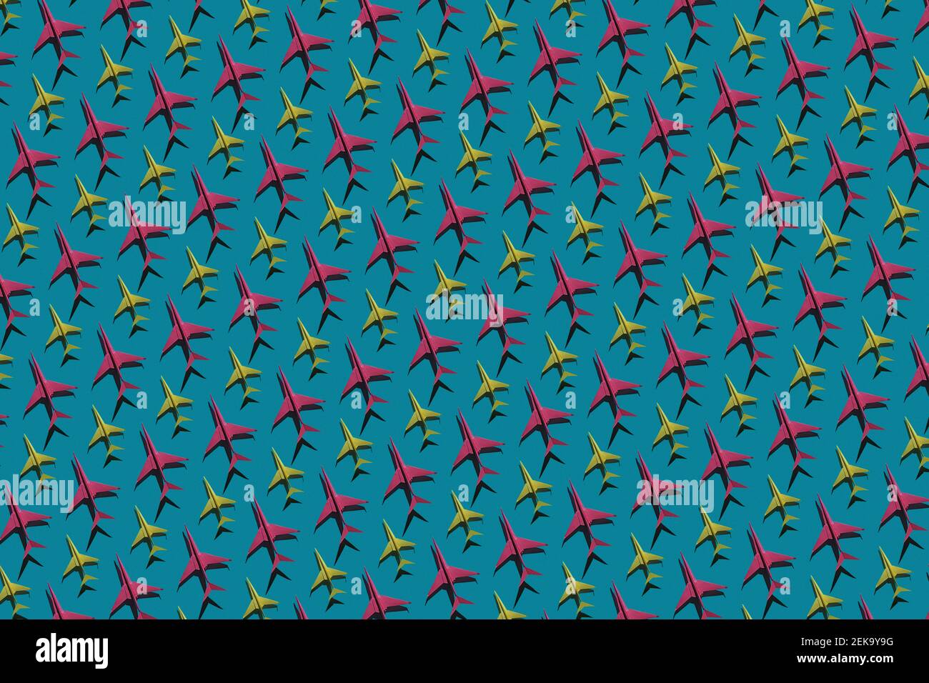 Pattern of pink and yellow origami airplanes Stock Photo
